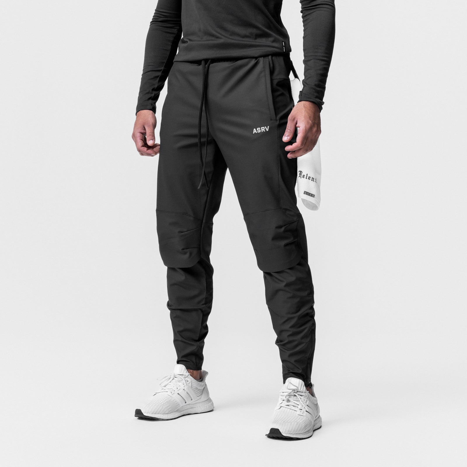 Black Tetra-Lite Moto Jogger worn by model with white sneakers, front view