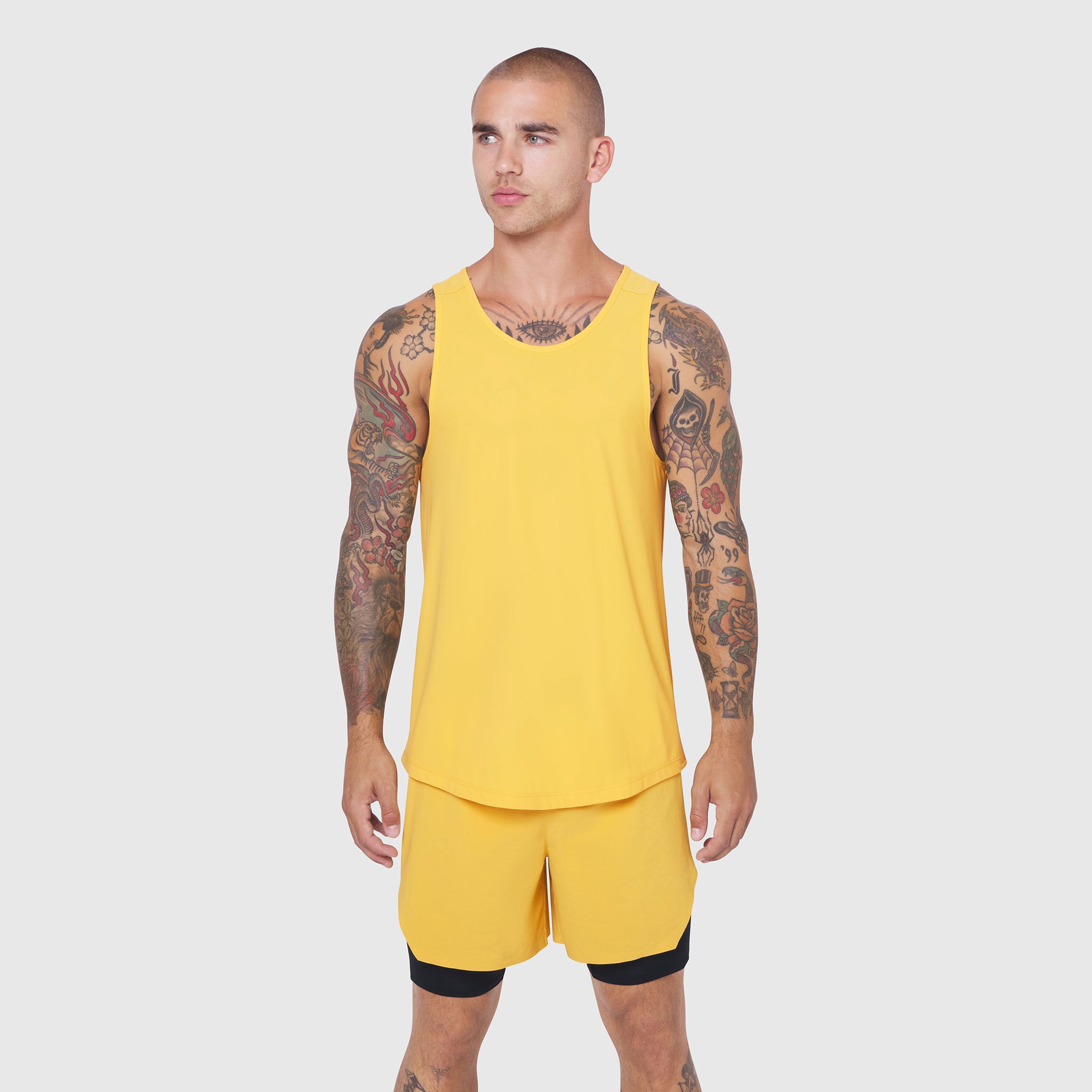 Laser-Vent Tank Top in amber yellow with matching shorts on model, front view