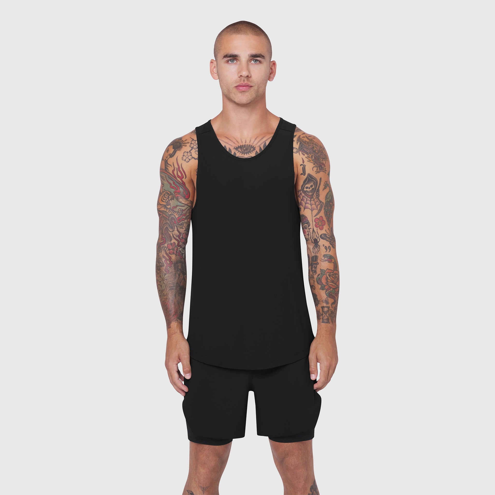 Black Laser-Vent Tank Top worn by model with tattoos, front view