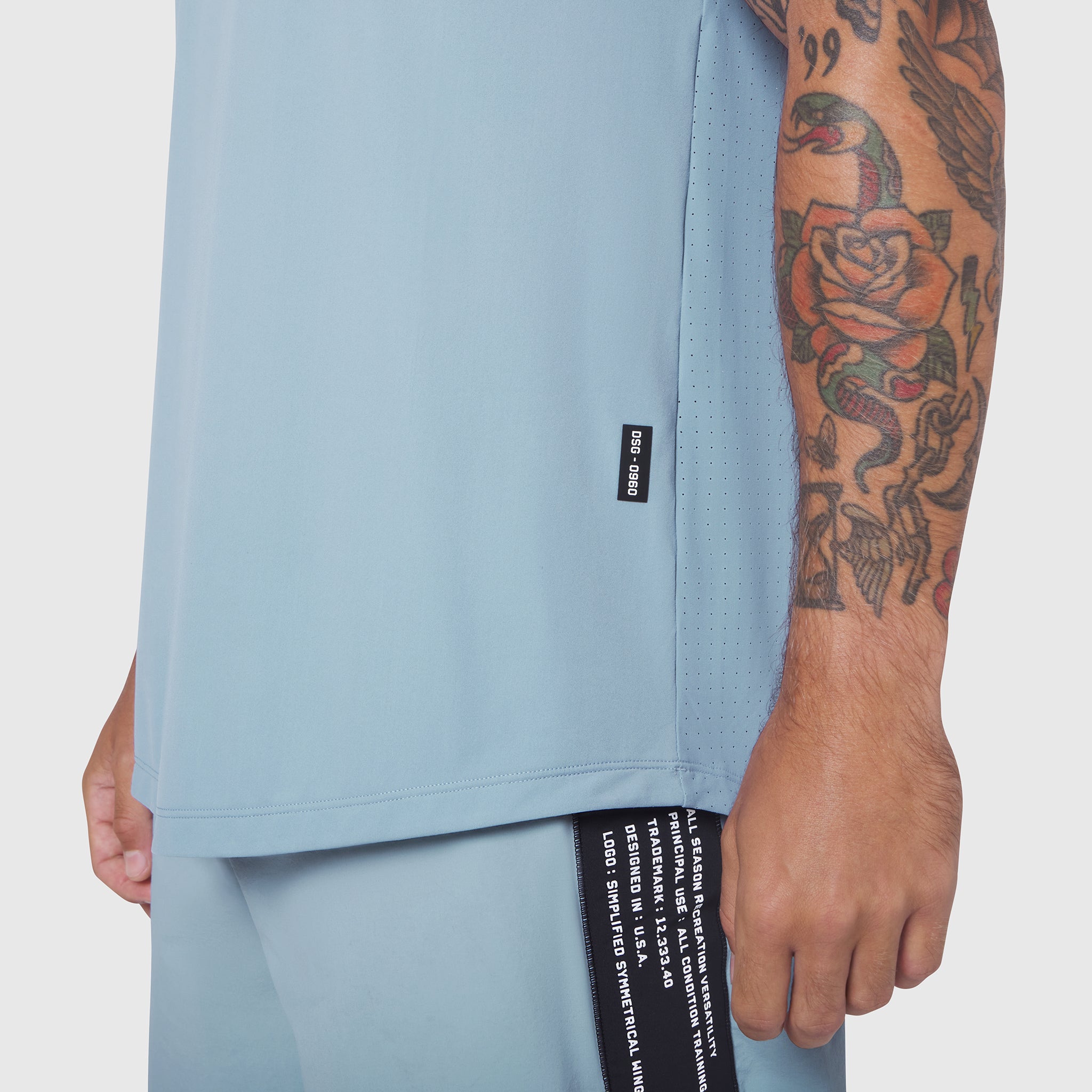 Laser-Vent™ Tank Top in Light Sky worn by model showing side view and fabric detail