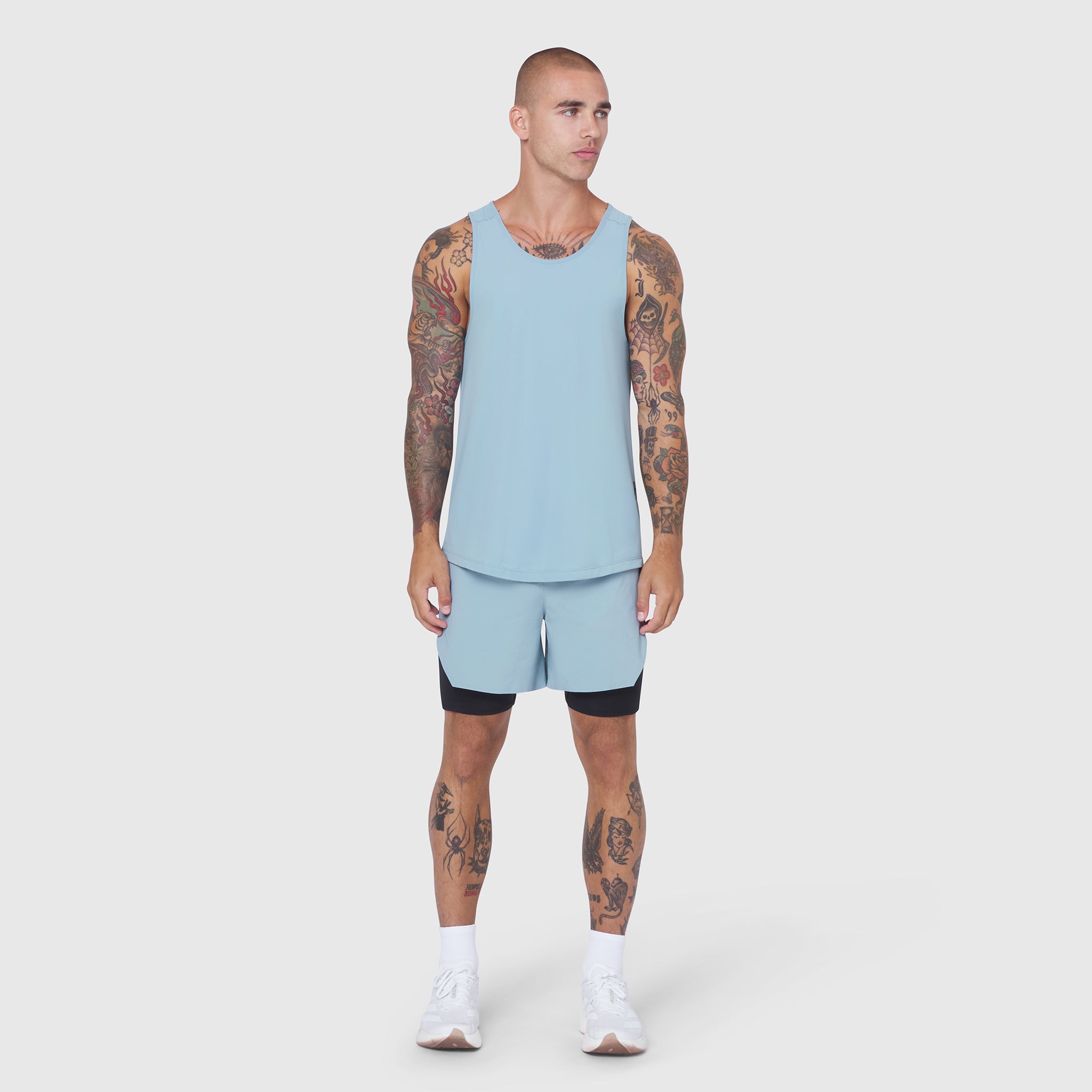 Laser-Vent Tank Top in light sky worn with matching shorts, front view on model