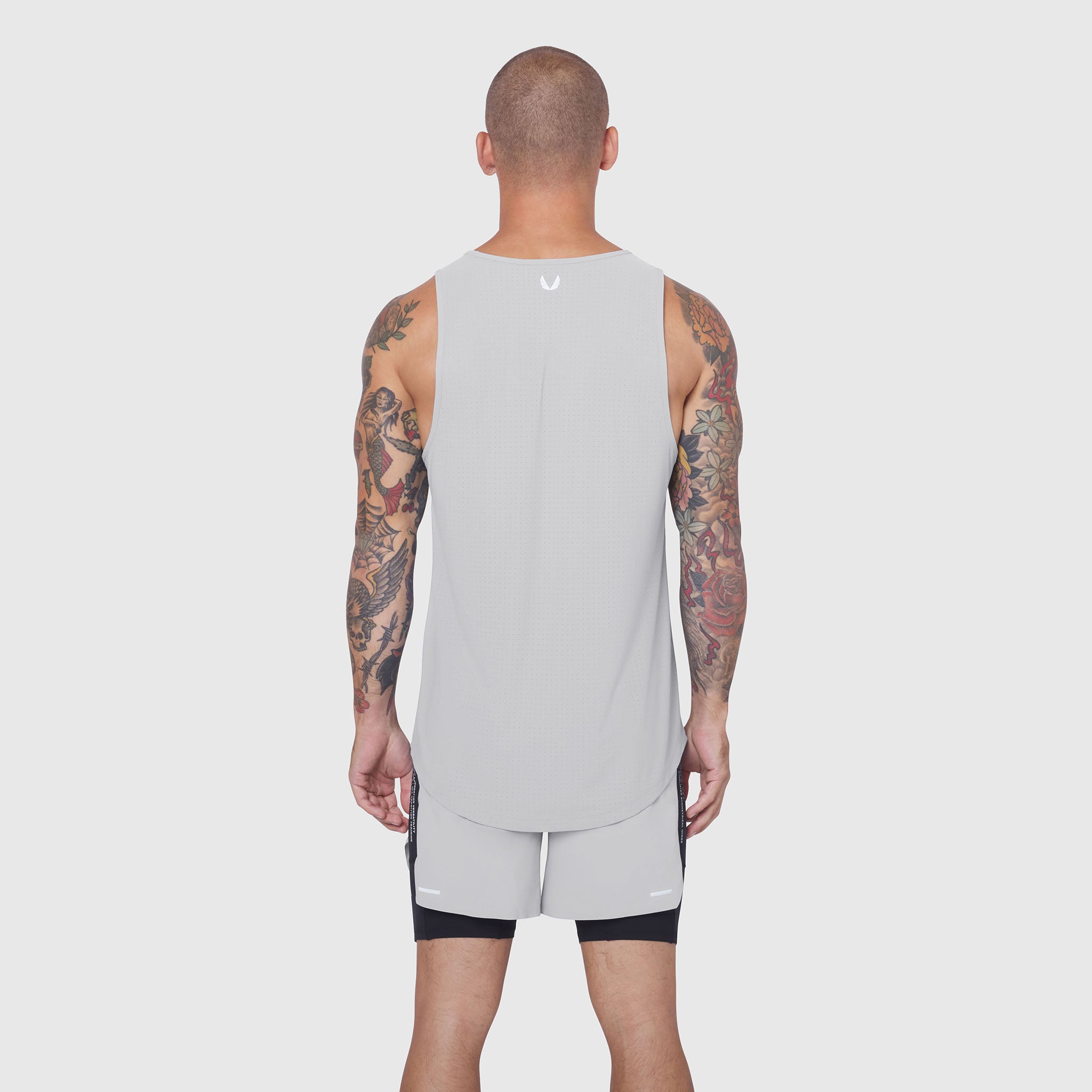Laser-Vent™ Tank Top in slate grey, back view on model with tattoos