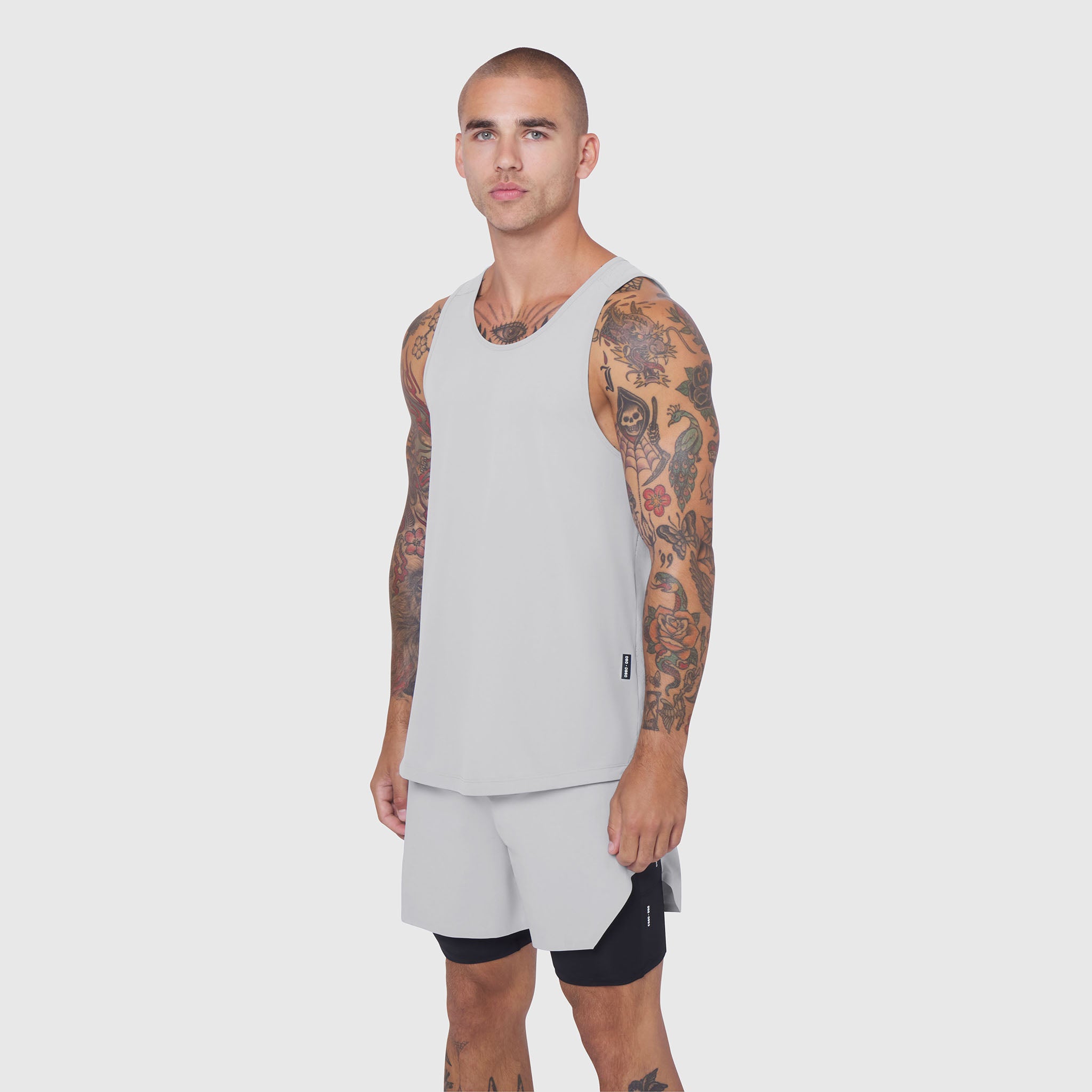 Laser-Vent Tank Top in slate grey worn with matching shorts, front view