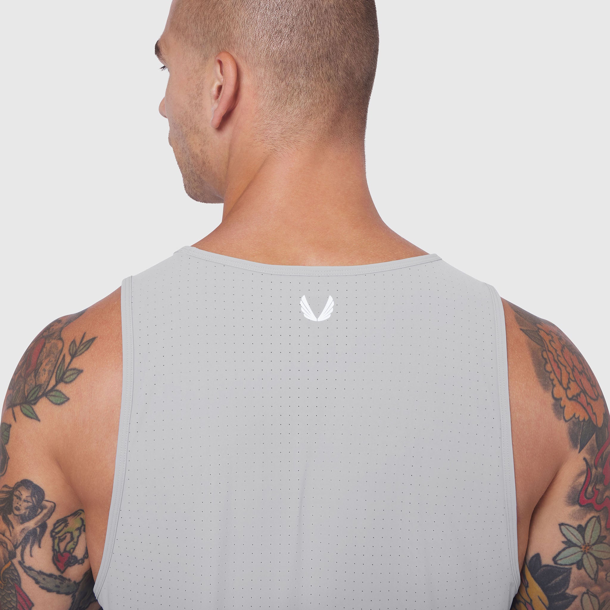 Laser-Vent Tank Top in slate grey, back view on model with visible tattoos