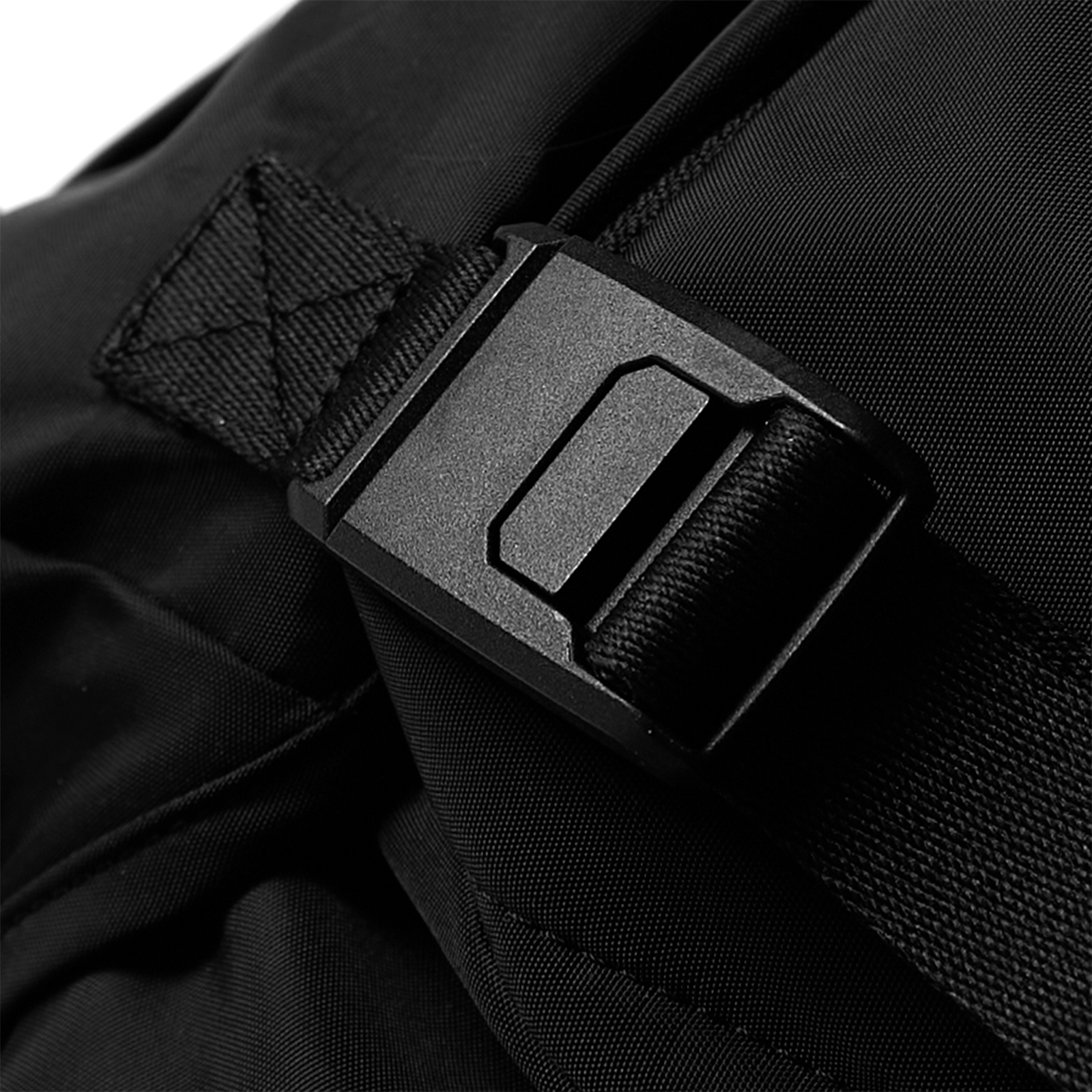 Flatlay Waterproof MOLLE Backpack in black, buckle detail closeup