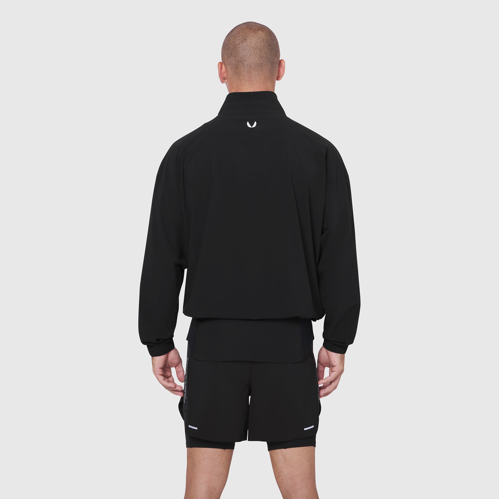 Aerotex Quarter-Zip Jacket in black, worn by model from back view