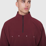 Aerotex Quarter-Zip Jacket in crimson, modeled on male wearing half-zip pullover