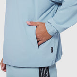 Aerotex Quarter-Zip Jacket in light sky blue, worn by model with hand in pocket