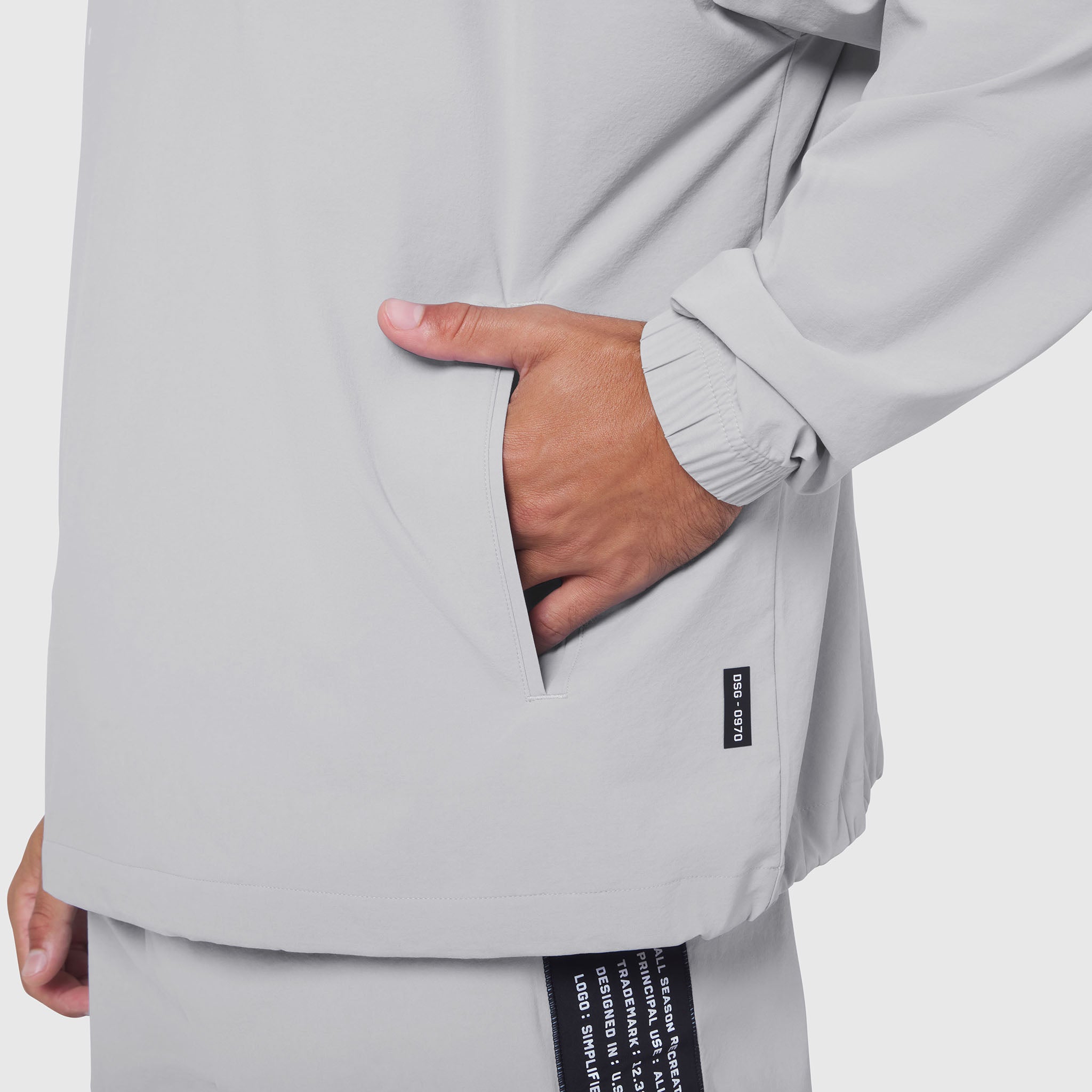 Aerotex Quarter-Zip Jacket in slate grey, model wearing jacket with hand in pocket