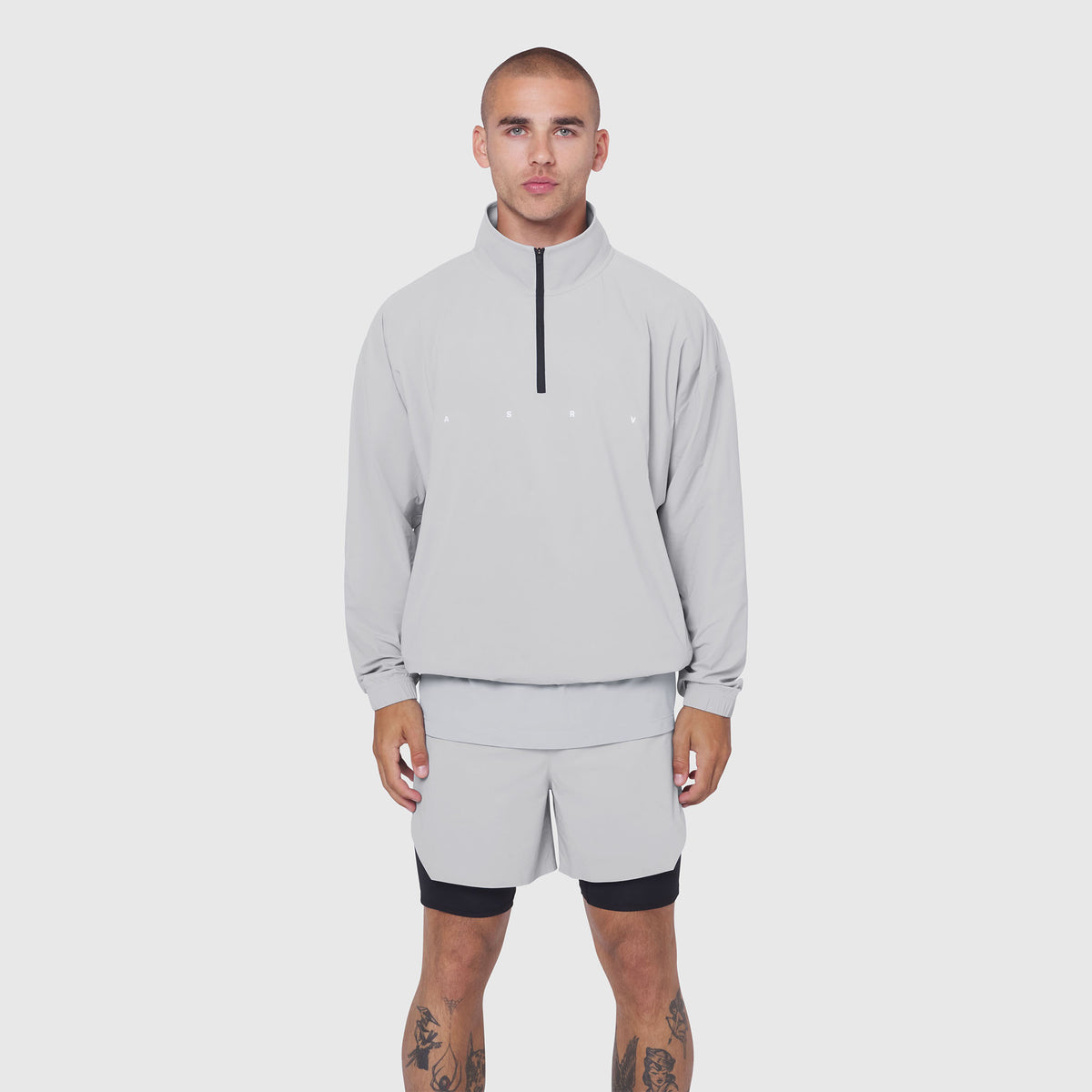 Aerotex Quarter-Zip Jacket in slate grey worn with matching shorts, front view