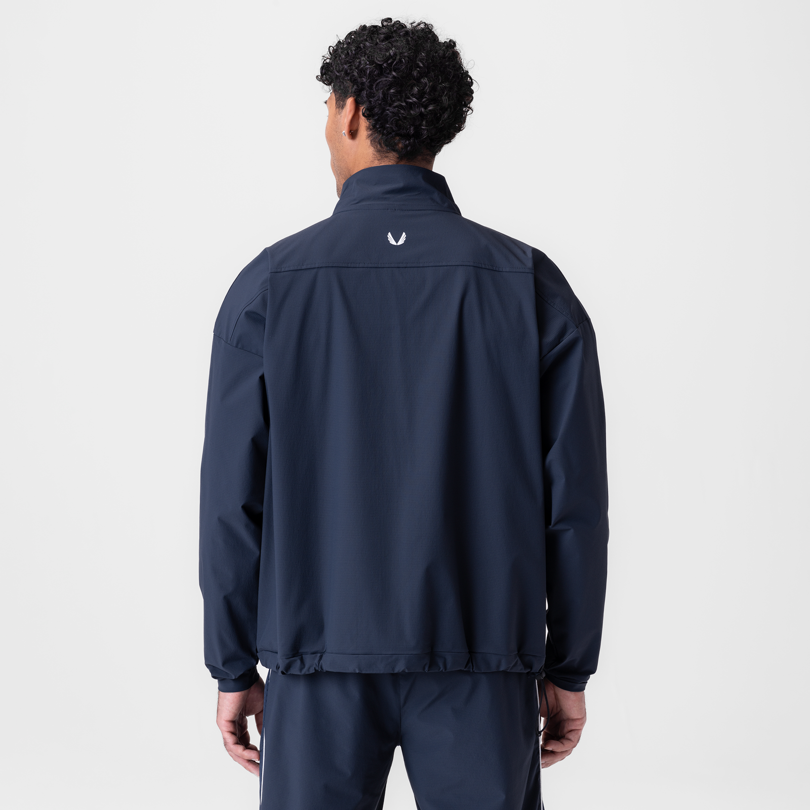 Ripstop Quarter Zip Jacket in navy worn by model, back view
