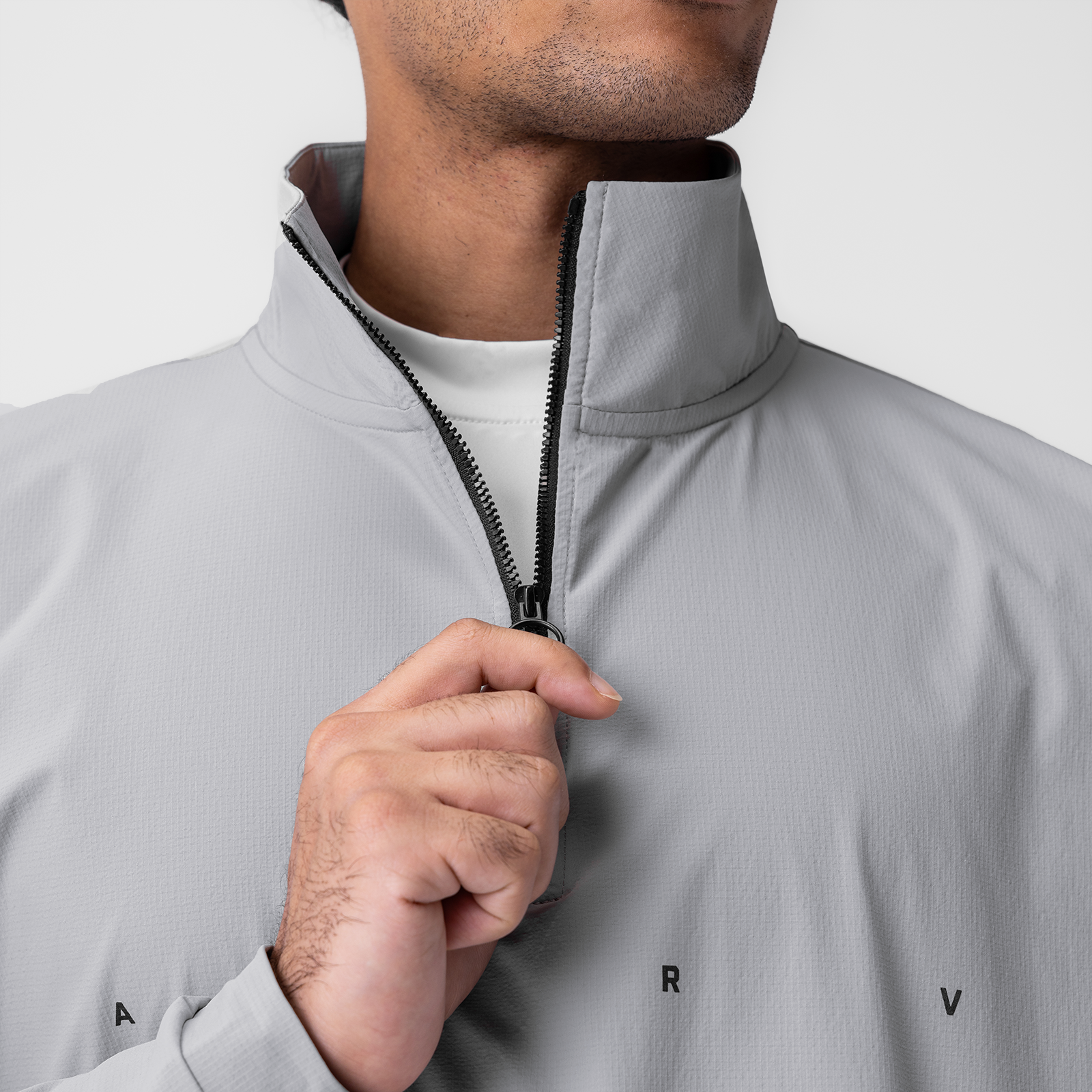 Ripstop Quarter Zip Jacket in slate grey worn by model, front view with hand on zipper