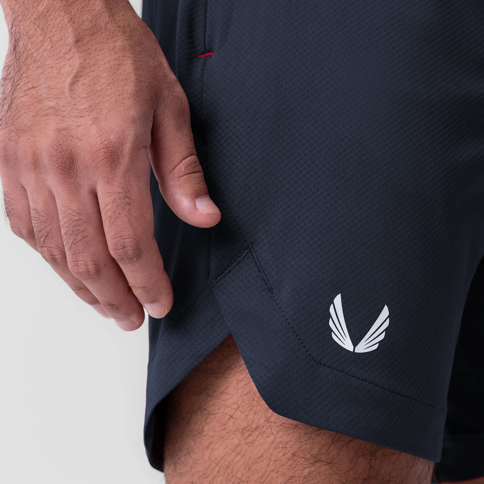AeroSilver 7" linerless short in navy, worn by model, side detail view