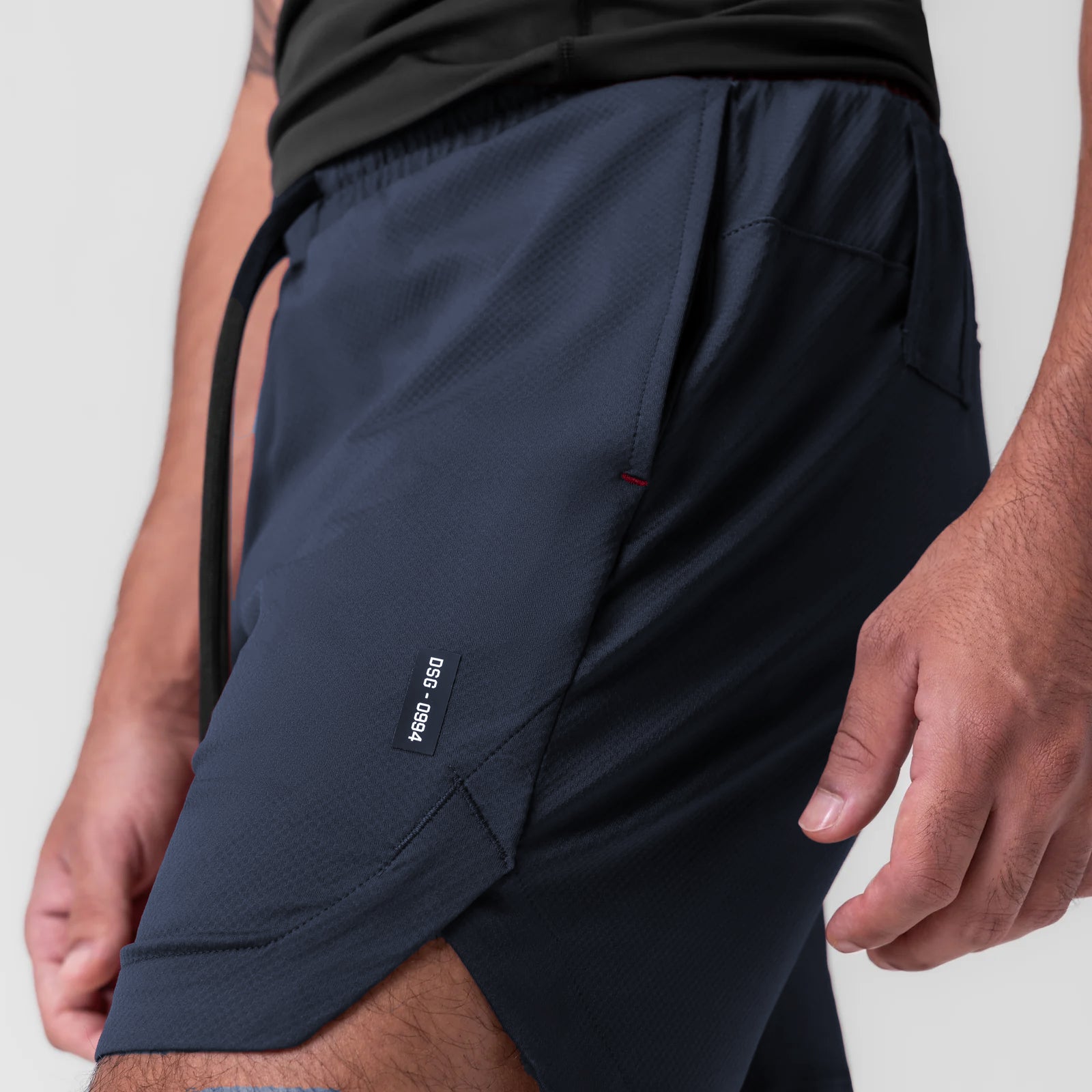 AeroSilver 7" linerless short in navy, worn by model showing side view