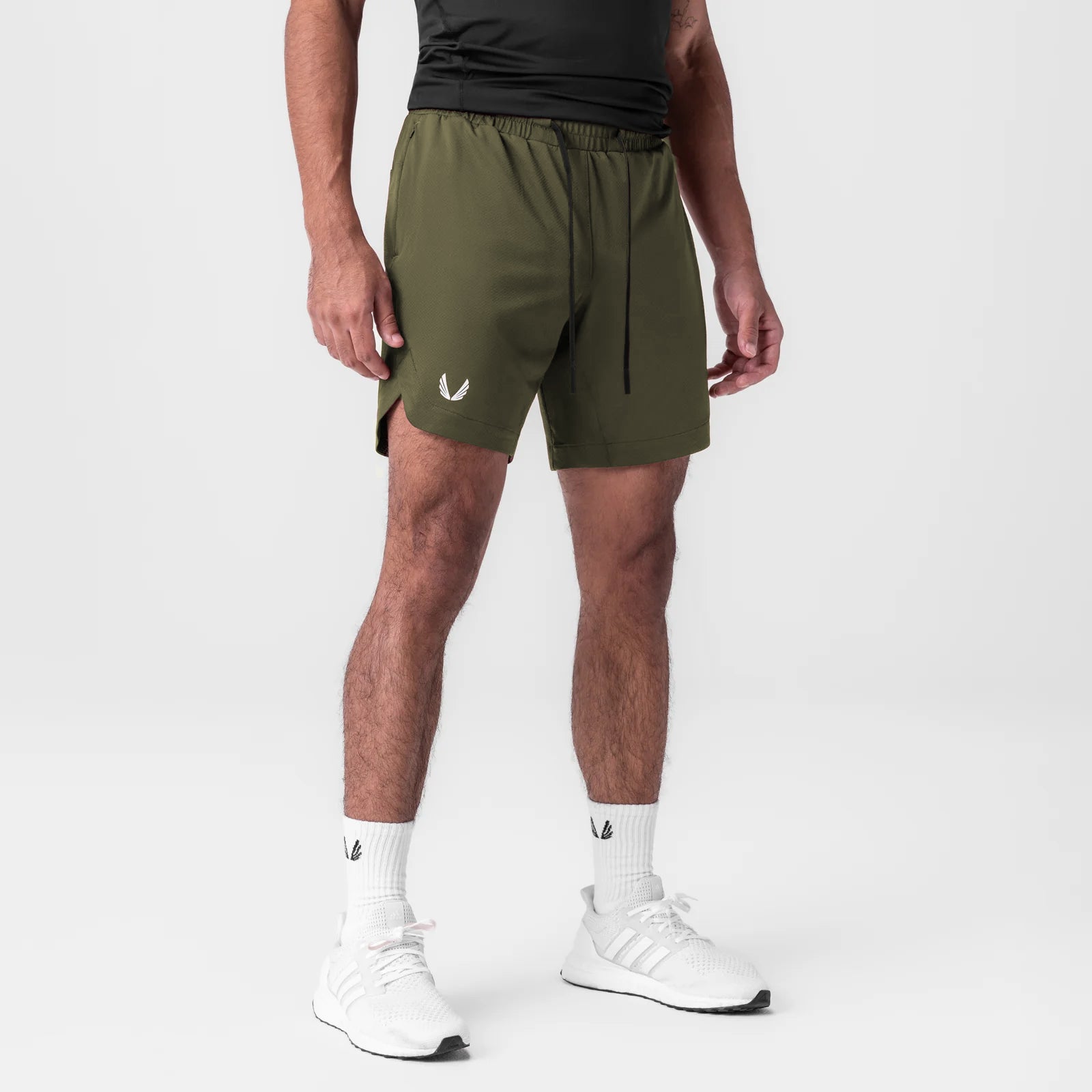 AeroSilver 7" linerless shorts in olive, worn by model with white sneakers and socks