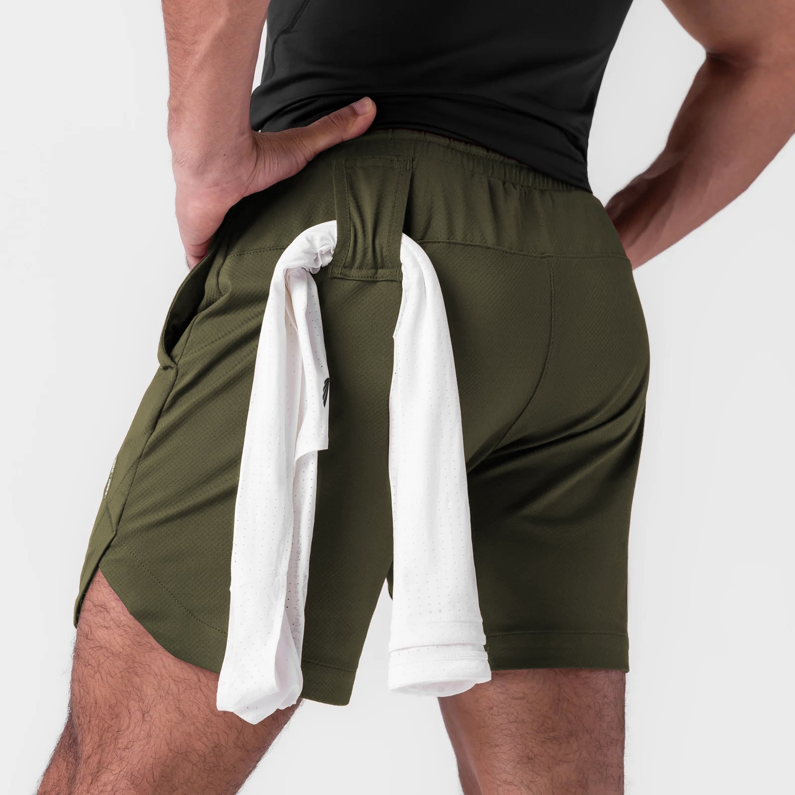AeroSilver 7" linerless short in olive worn by model, back view with towel