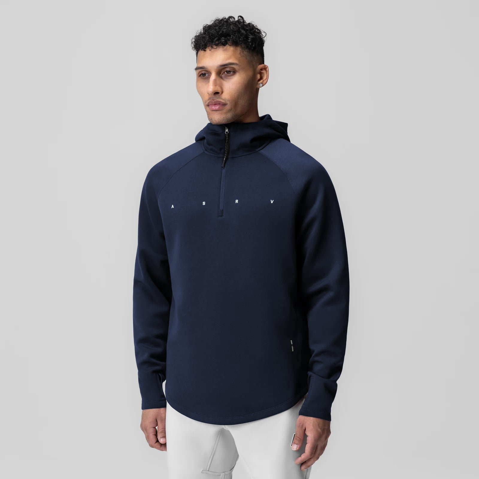Dri-Core Zip Hoodie in navy worn by model, front view