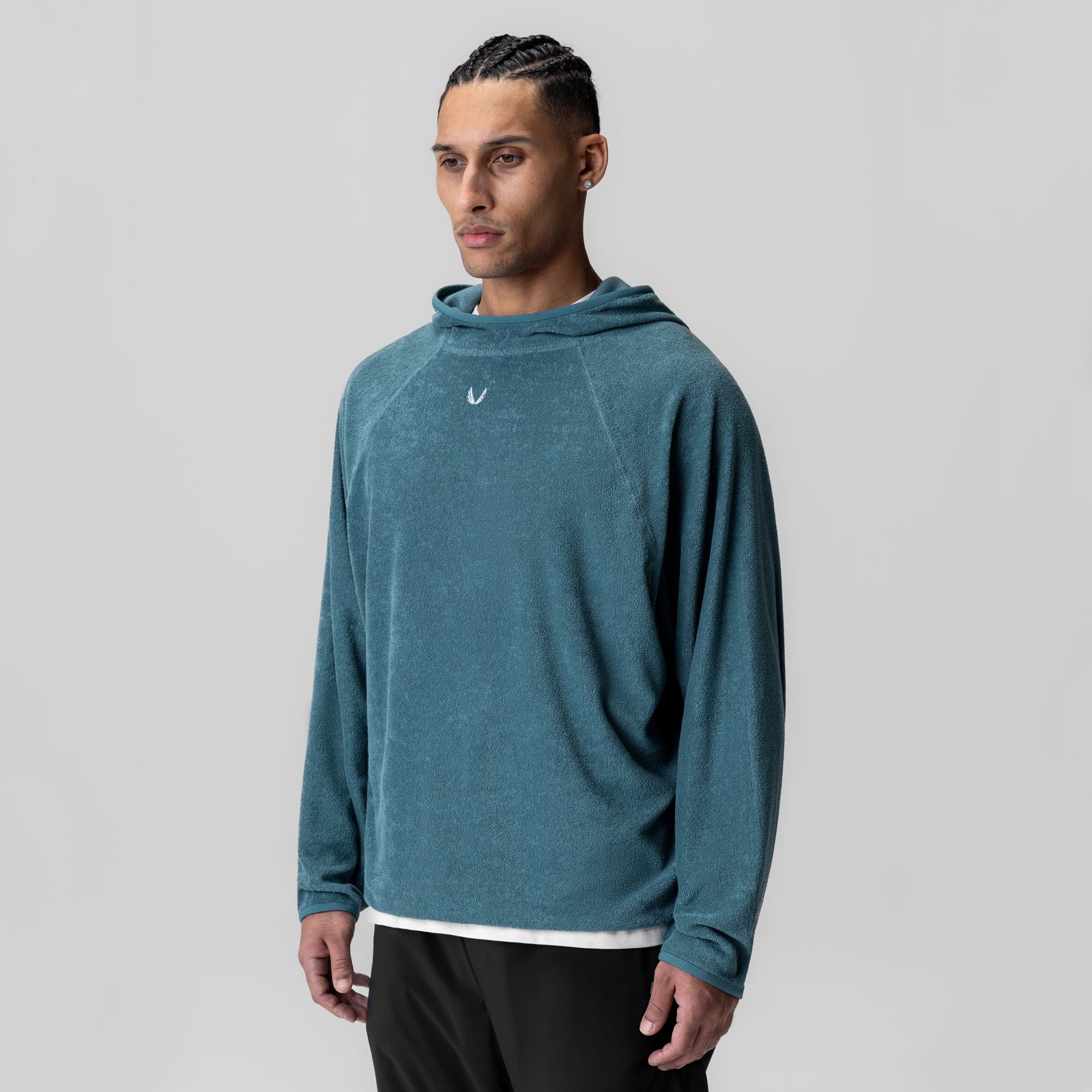 Towel Terry Reversible Hoodie in storm blue, worn by model, front view