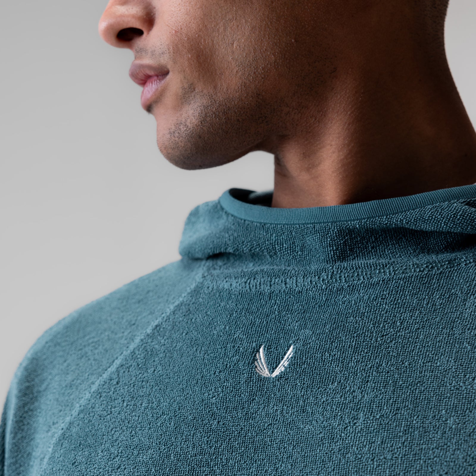 Towel Terry Reversible Hoodie in Storm blue, worn by model in profile view