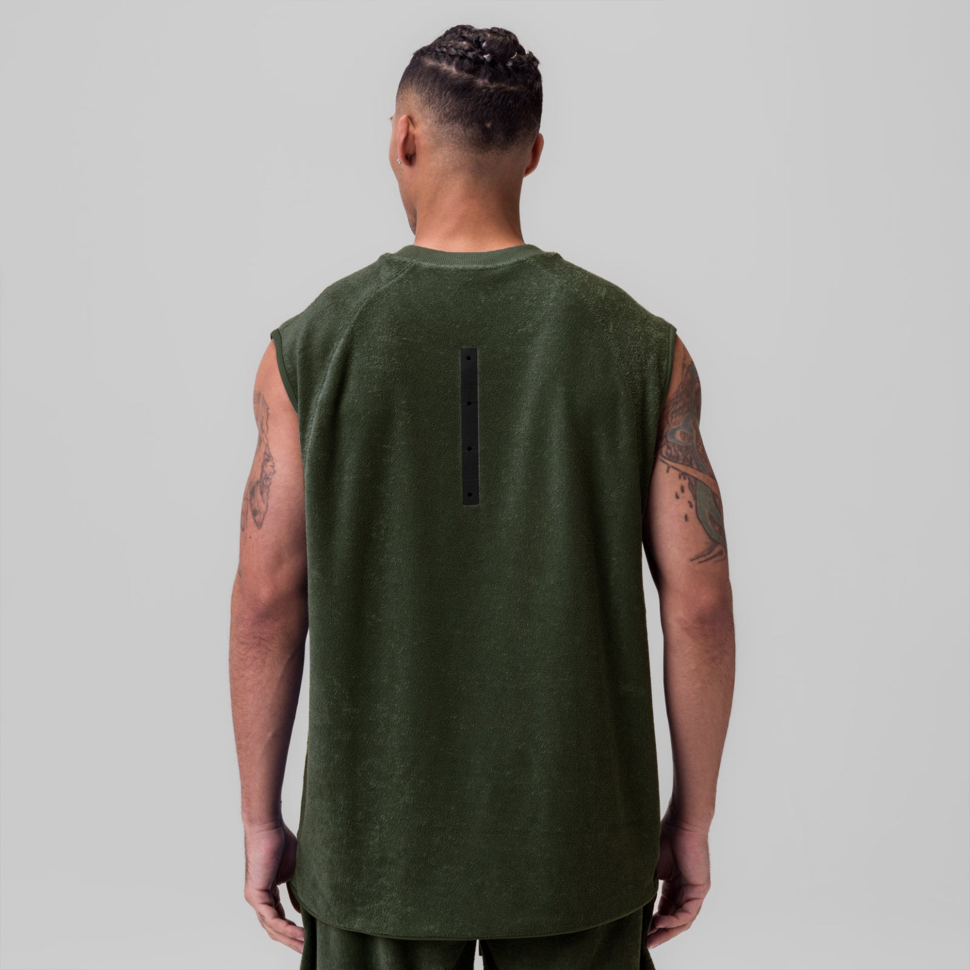 Towel Terry Cutoff tank in olive, back view on model
