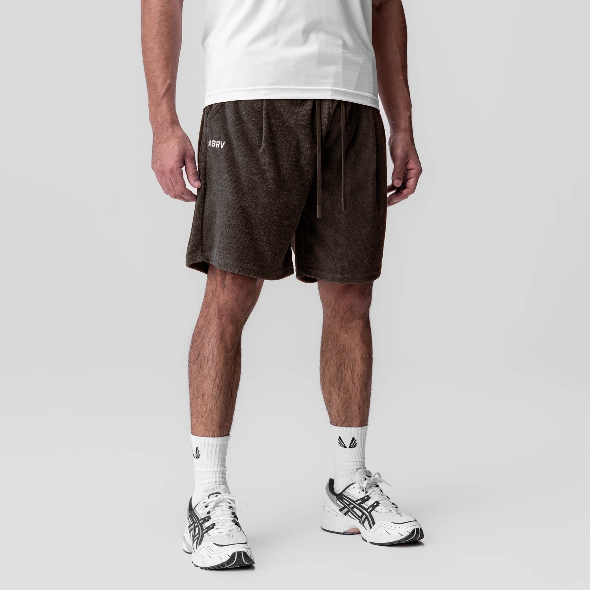 Towel Terry Relaxed Short in Dark Earth worn by model with white socks and sneakers