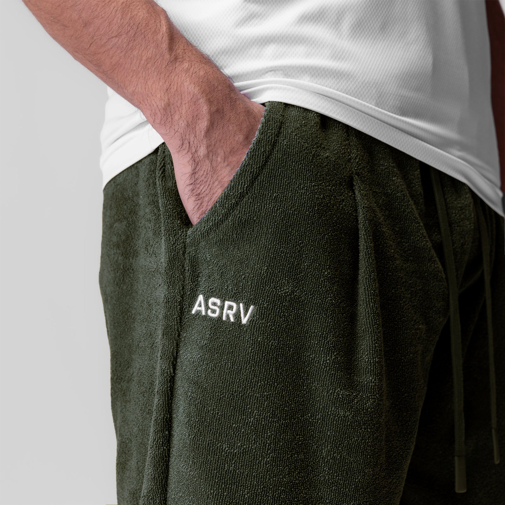 Towel Terry Relaxed Short in olive worn by model with hand in pocket, showing fit and fabric