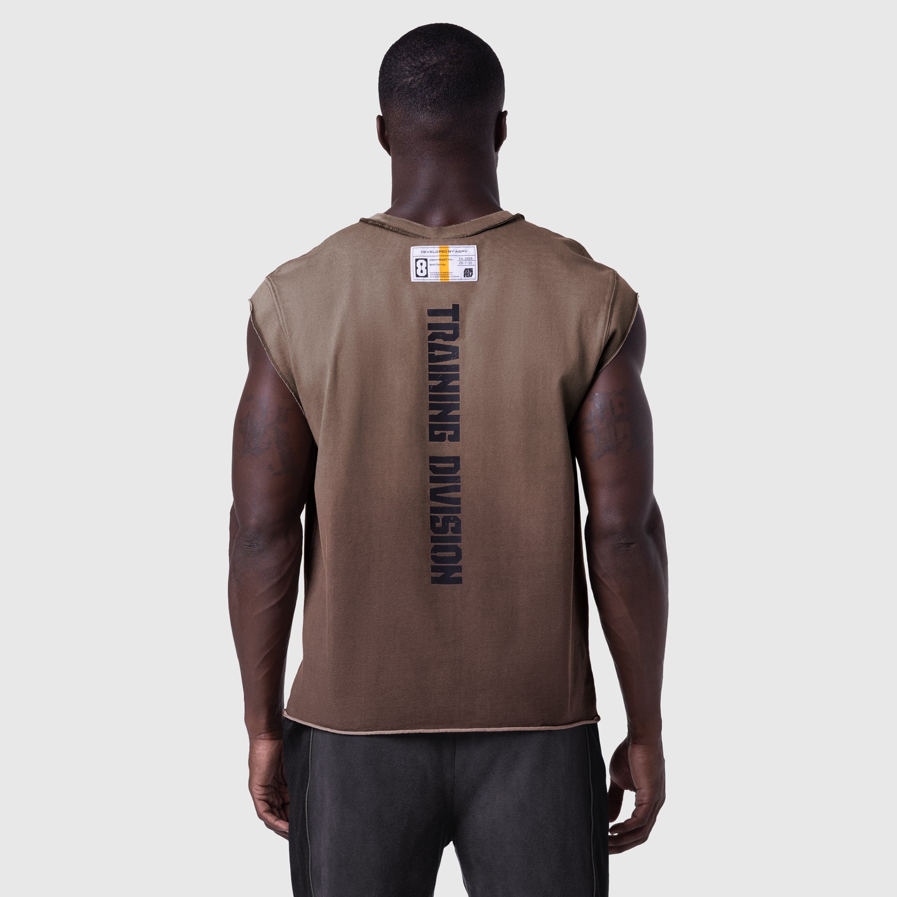 Tech Essential Cap Shoulder Cutoff tank in dark earth, back view on model