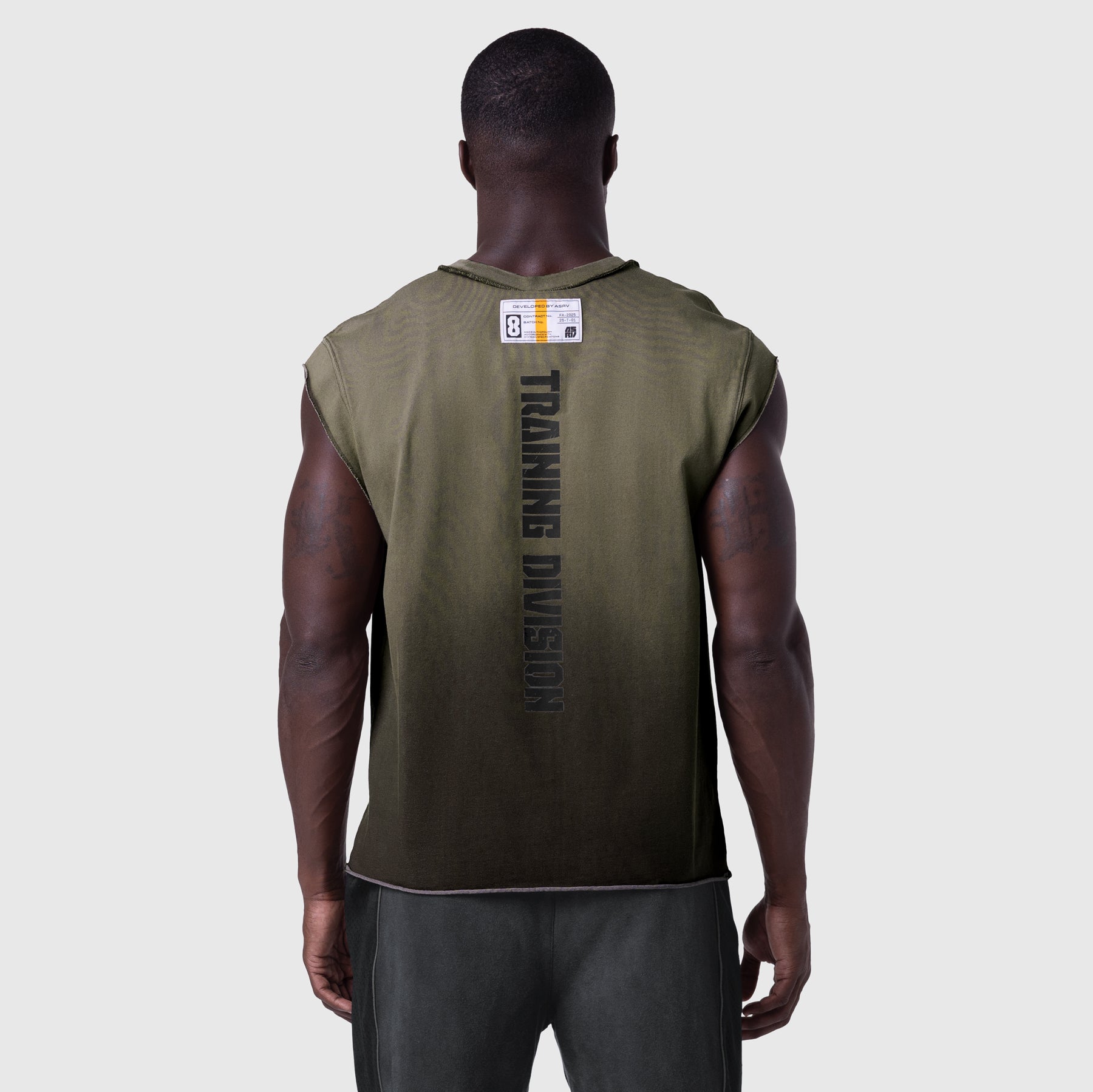 Tech Essential Cap Shoulder Cutoff in olive sun fade, back view on model