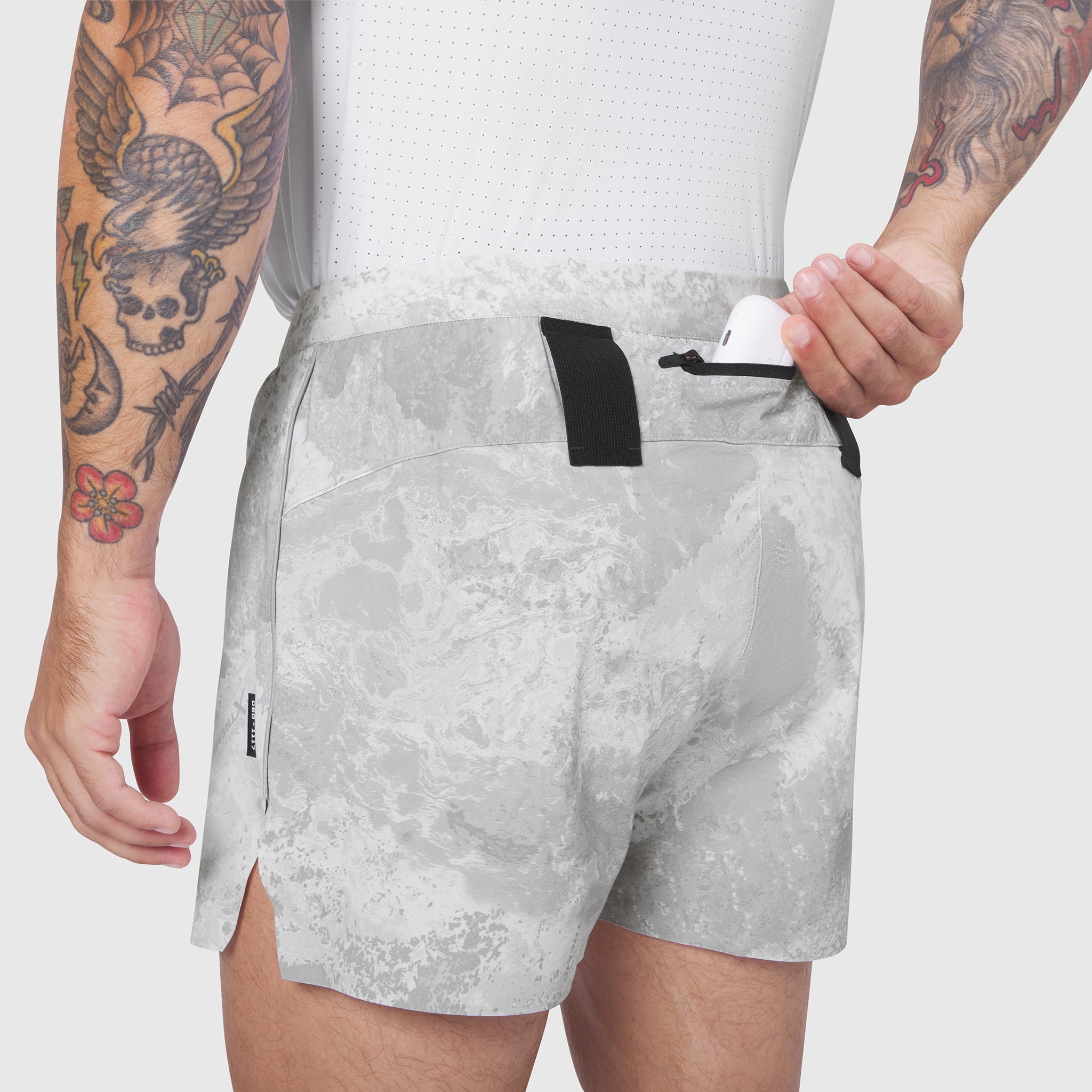 Aerotex Distance Short in white camo, worn by model showing back view with drawstring detail