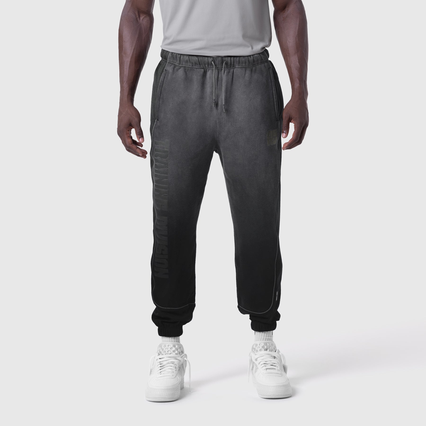 Black Tech-Terry mesh panel joggers worn by model, front view