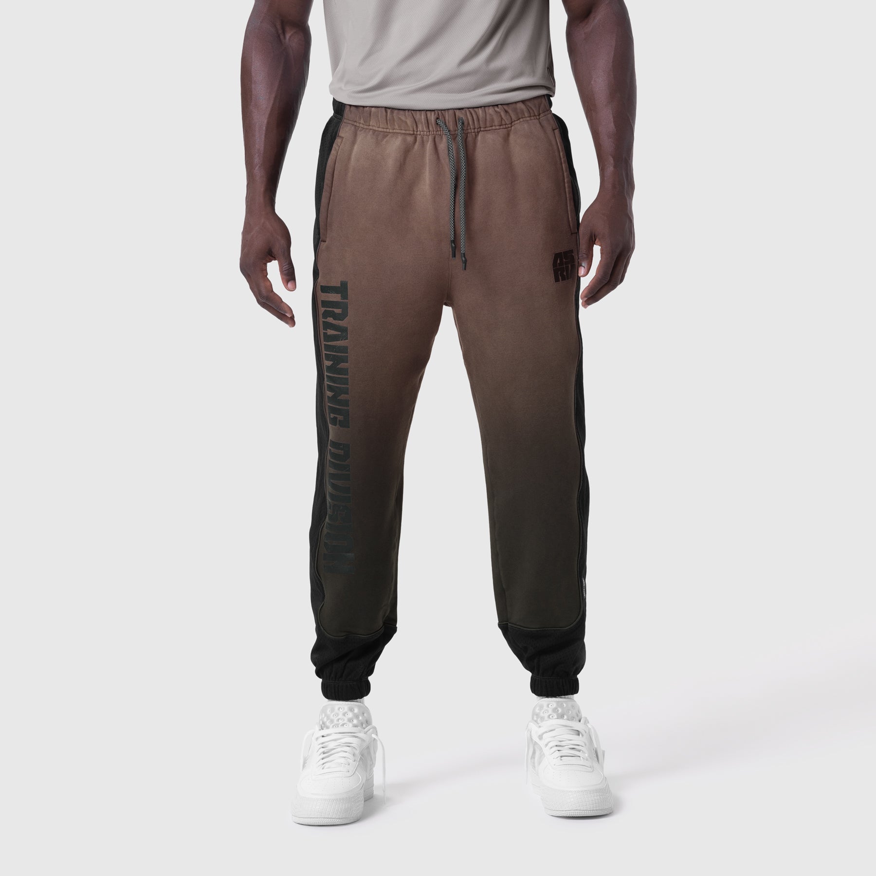 Tech-Terry Mesh Panel Sweats in Dark Earth, modeled front view with white sneakers