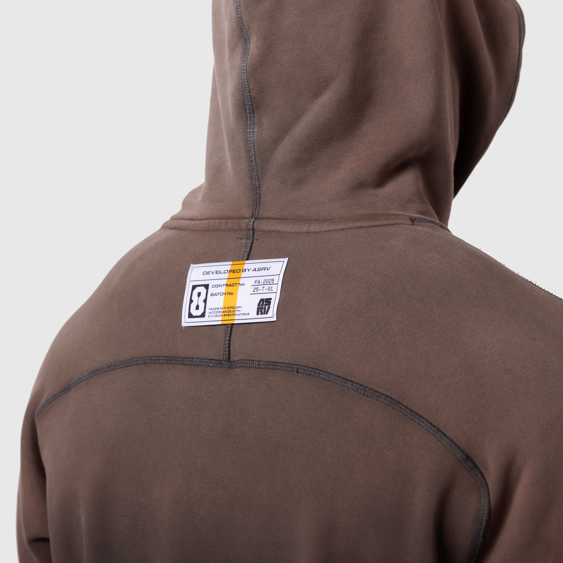 Tech-Terry Training Hoodie in dark earth worn by model, back view showing label detail
