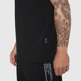 Laser-Vent™ Training Tee in black worn by model, side view showing sleeve and torso