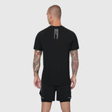 Black Laser-Vent Training Tee worn by model, back view showing rear design detail