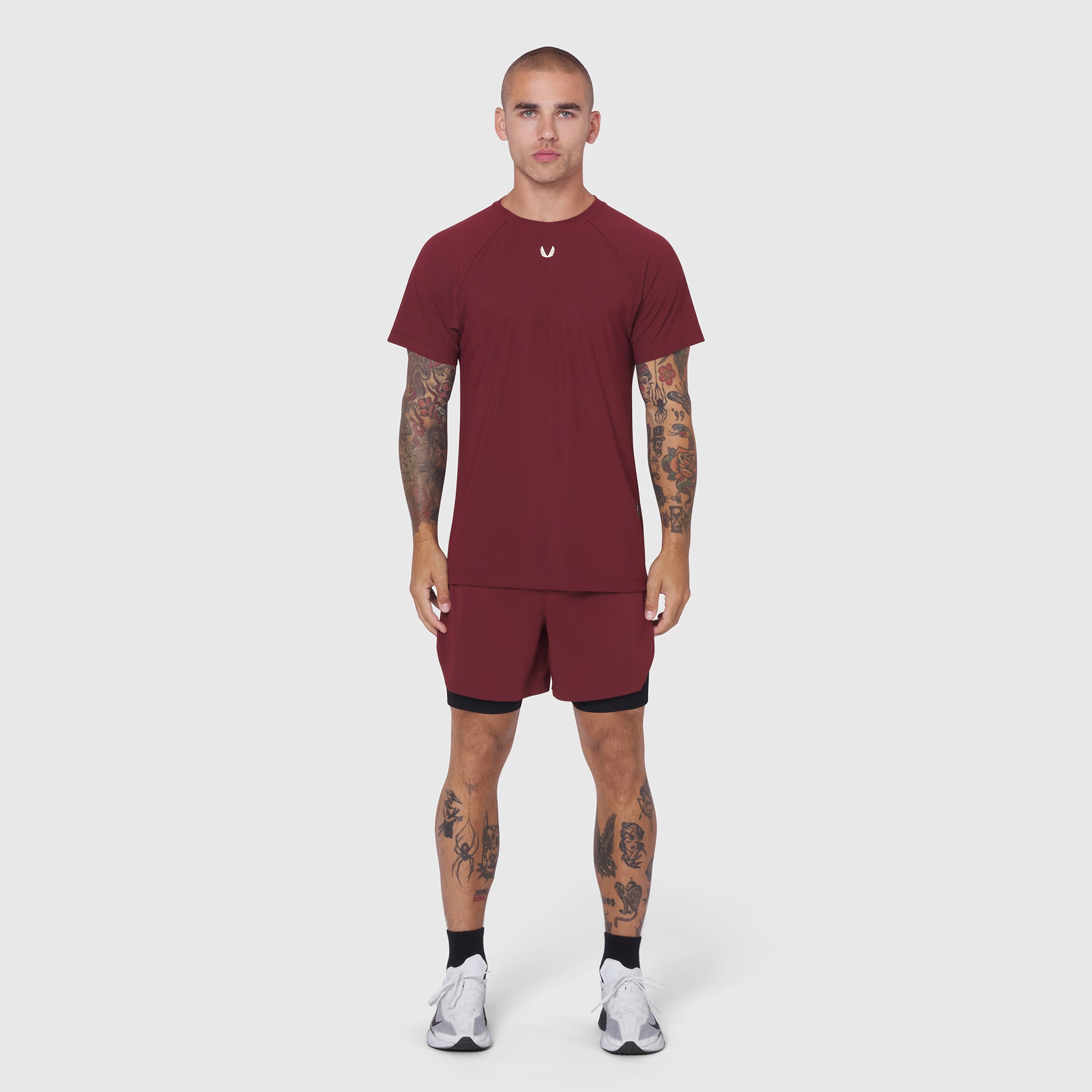 Laser-Vent Training Tee in crimson worn with matching shorts, front view on model