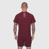 Laser-Vent Training Tee in crimson, back view on model with tattoos