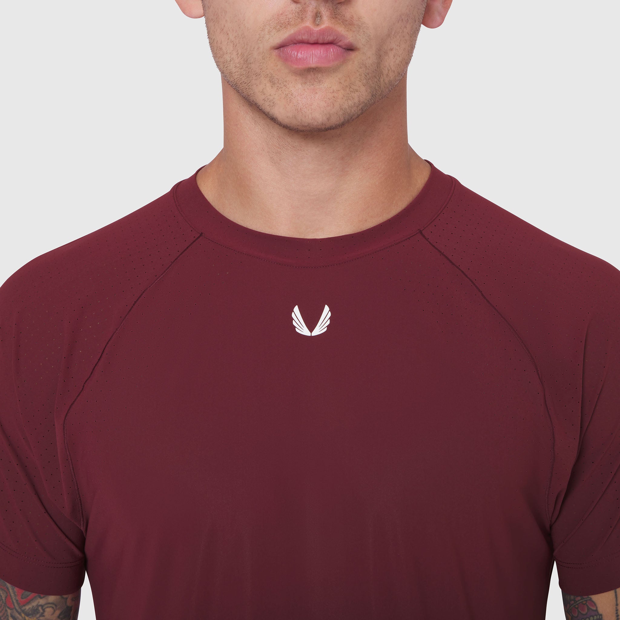 Laser-Vent™ Training Tee in crimson worn by male model, front view