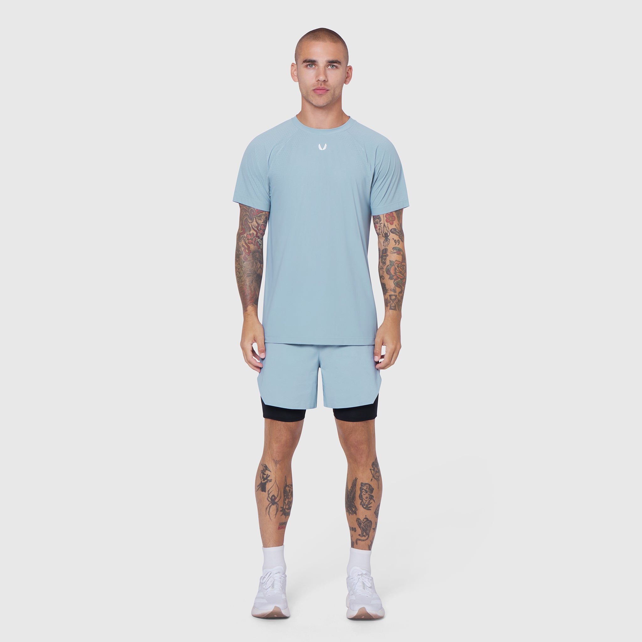 Laser-Vent Training Tee in light sky worn with matching shorts, front view