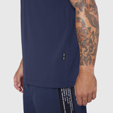 Laser-Vent Training Tee in navy worn by model showing side view with tattooed arm