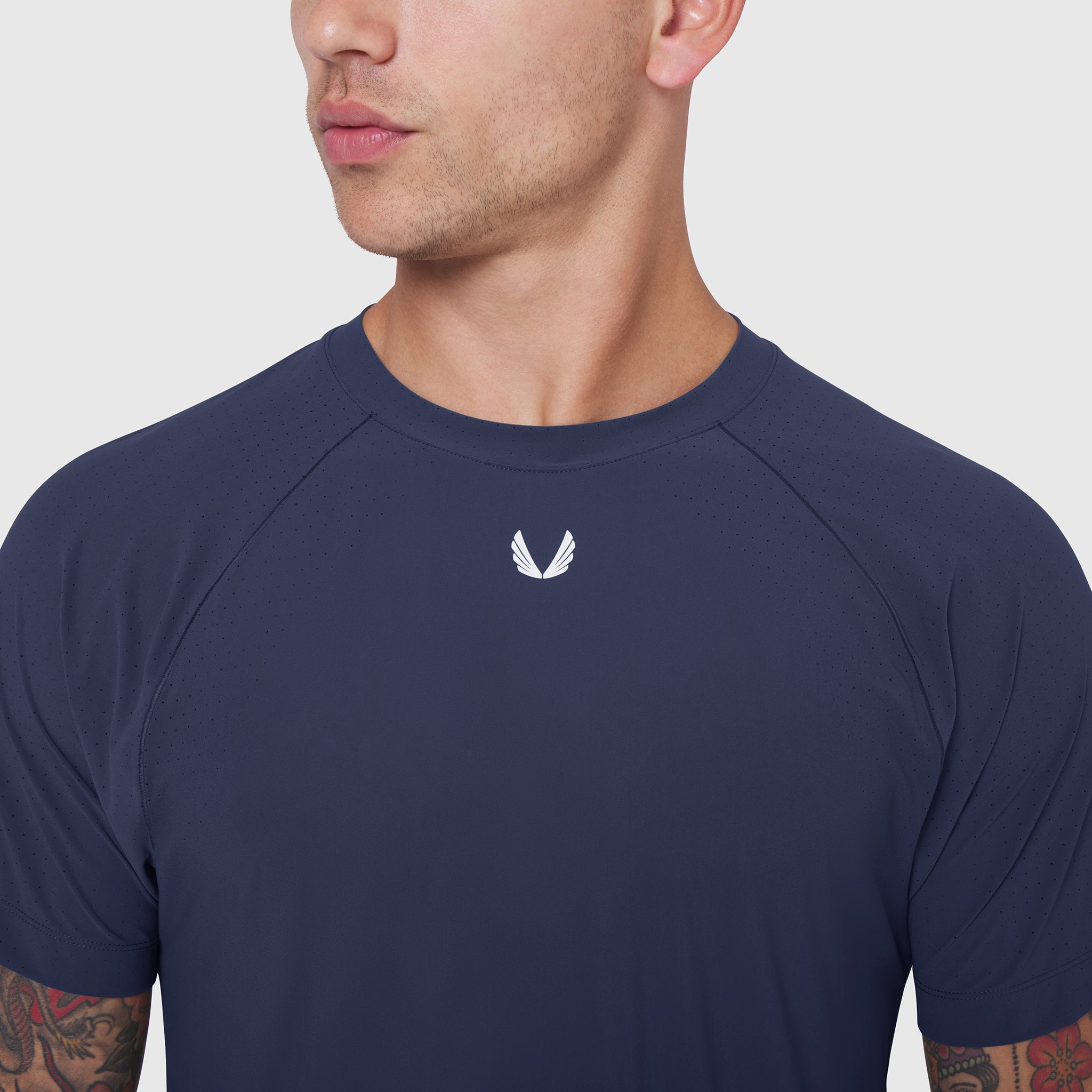 Laser-Vent Training Tee in navy worn by model, front view with small white logo
