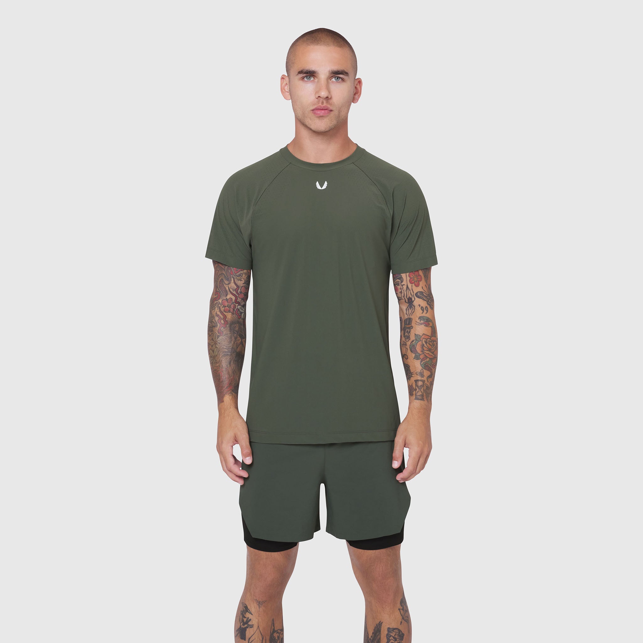 Laser-Vent Training Tee in olive worn by model with matching shorts, front view
