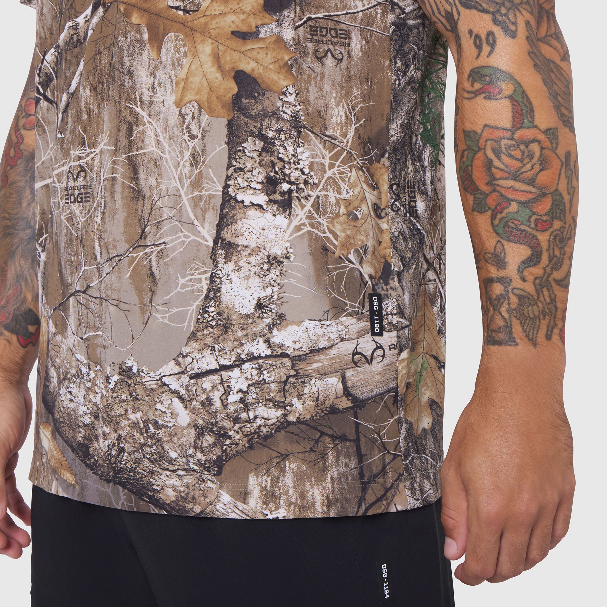 Laser-Vent Training Tee in Realtree Edge camo, worn by model showing front design and tattoos