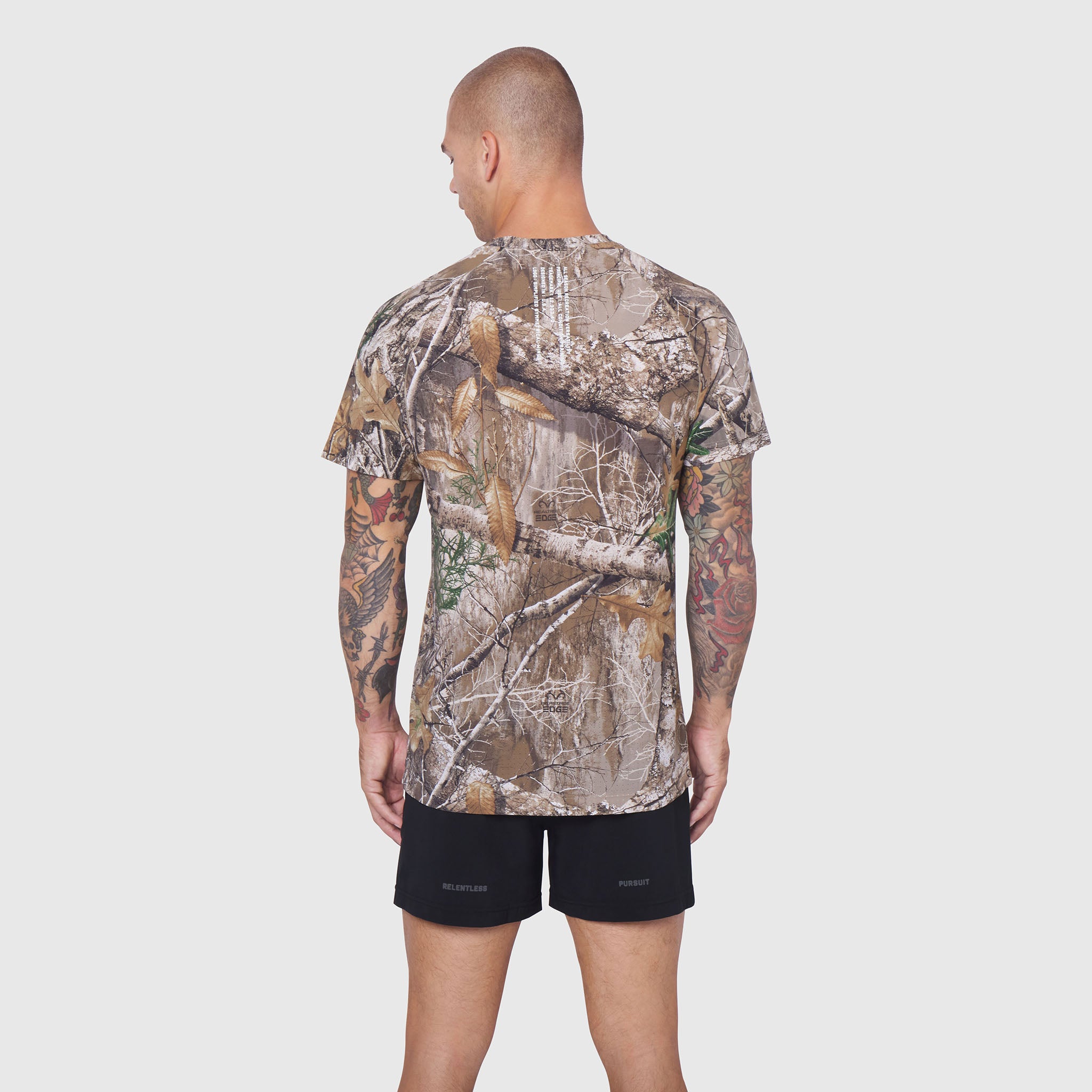 Laser-Vent Training Tee in Realtree Edge camo, rear view on model with tattoos