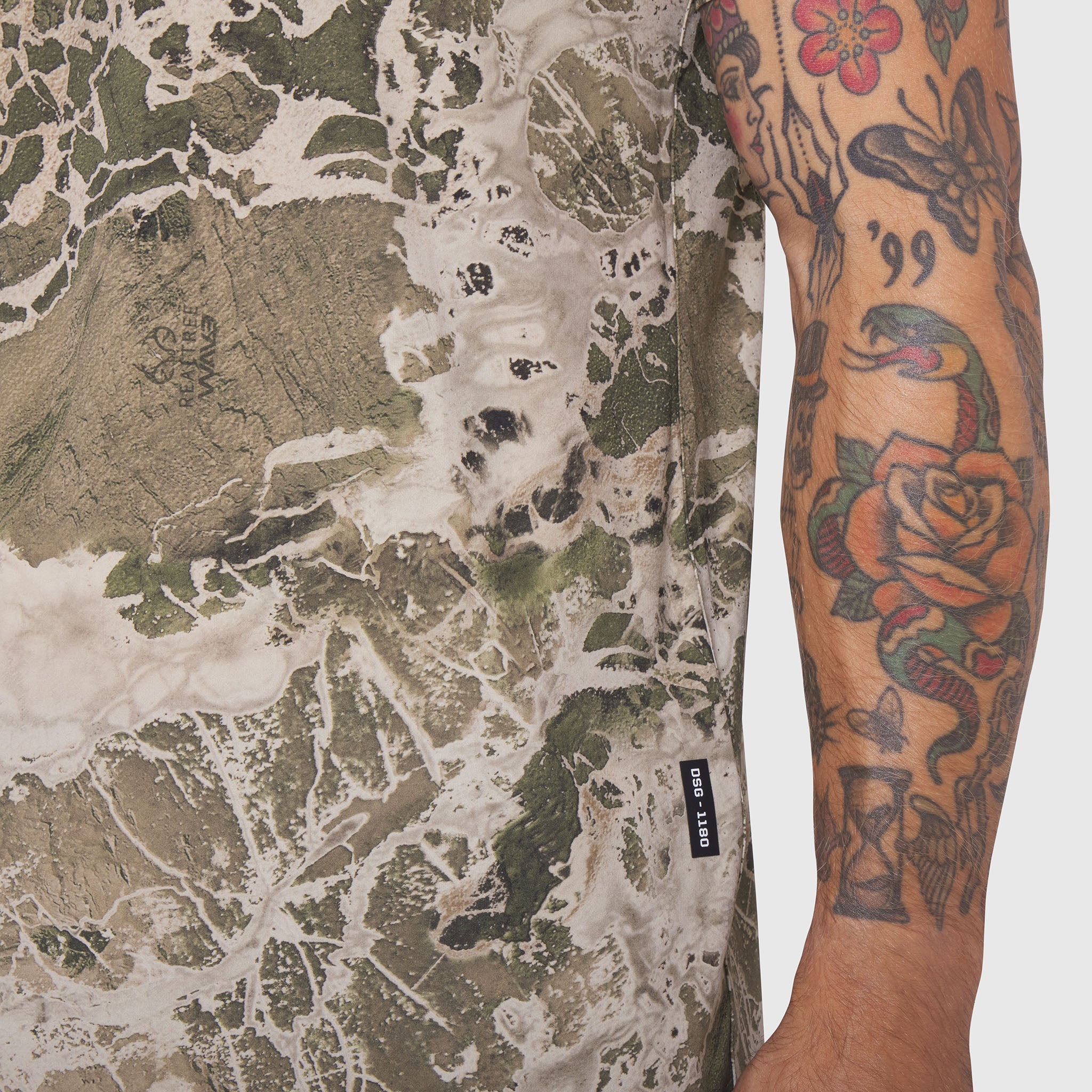 Laser-Vent Training Tee in Realtree WAV3 camo pattern, worn by model showing sleeve and torso