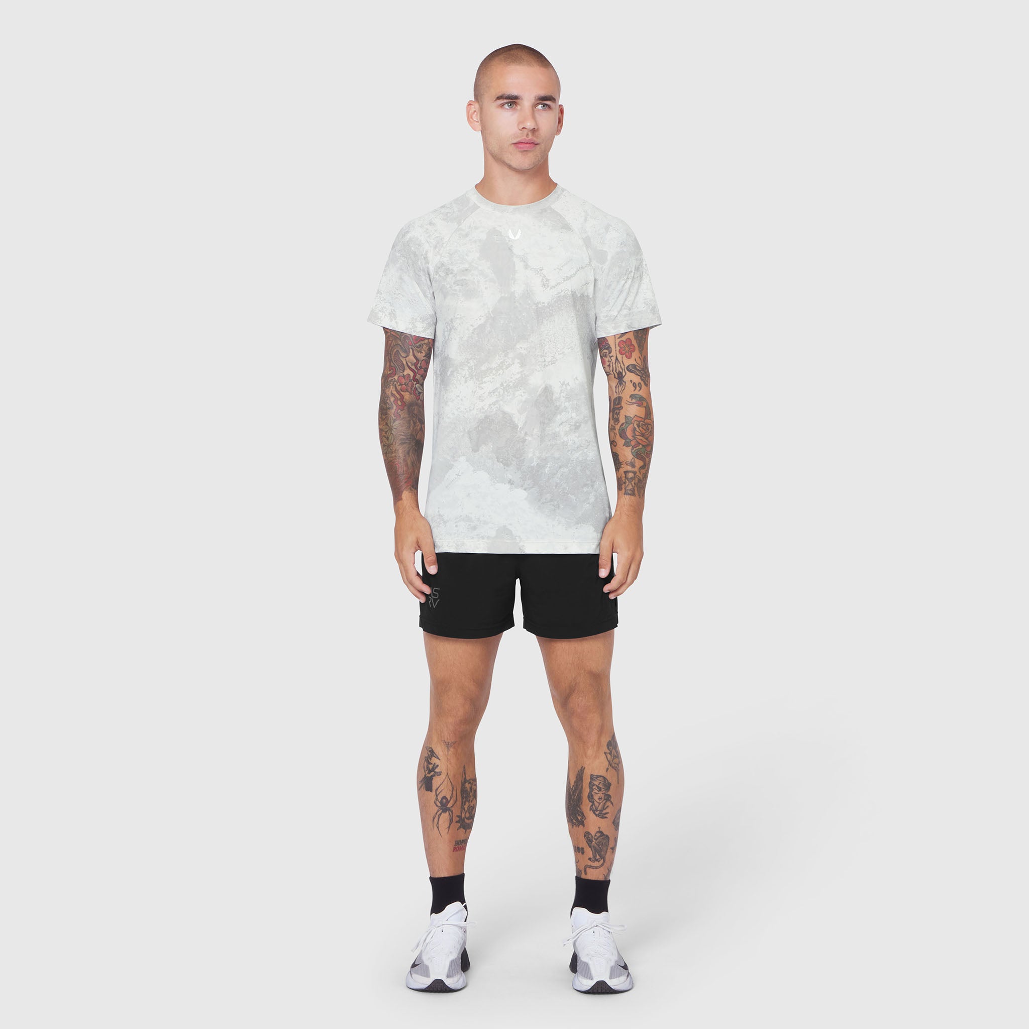 Laser-Vent Training Tee in grey tie-dye, worn with black shorts, front view on model