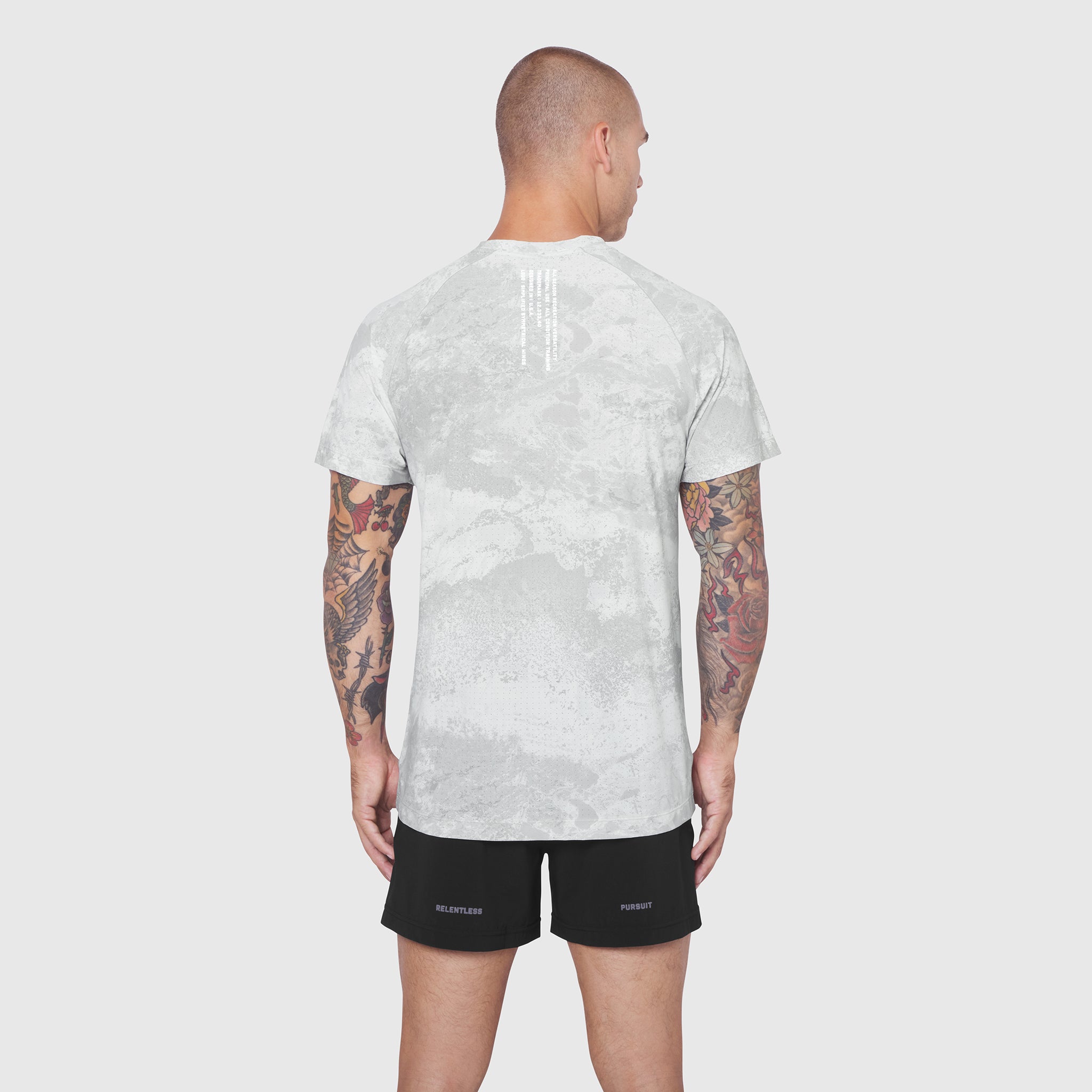 Laser-Vent Training Tee in white camo, back view on model with black shorts