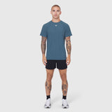 Laser-Vent Training Tee in storm blue worn with black shorts, front view on model