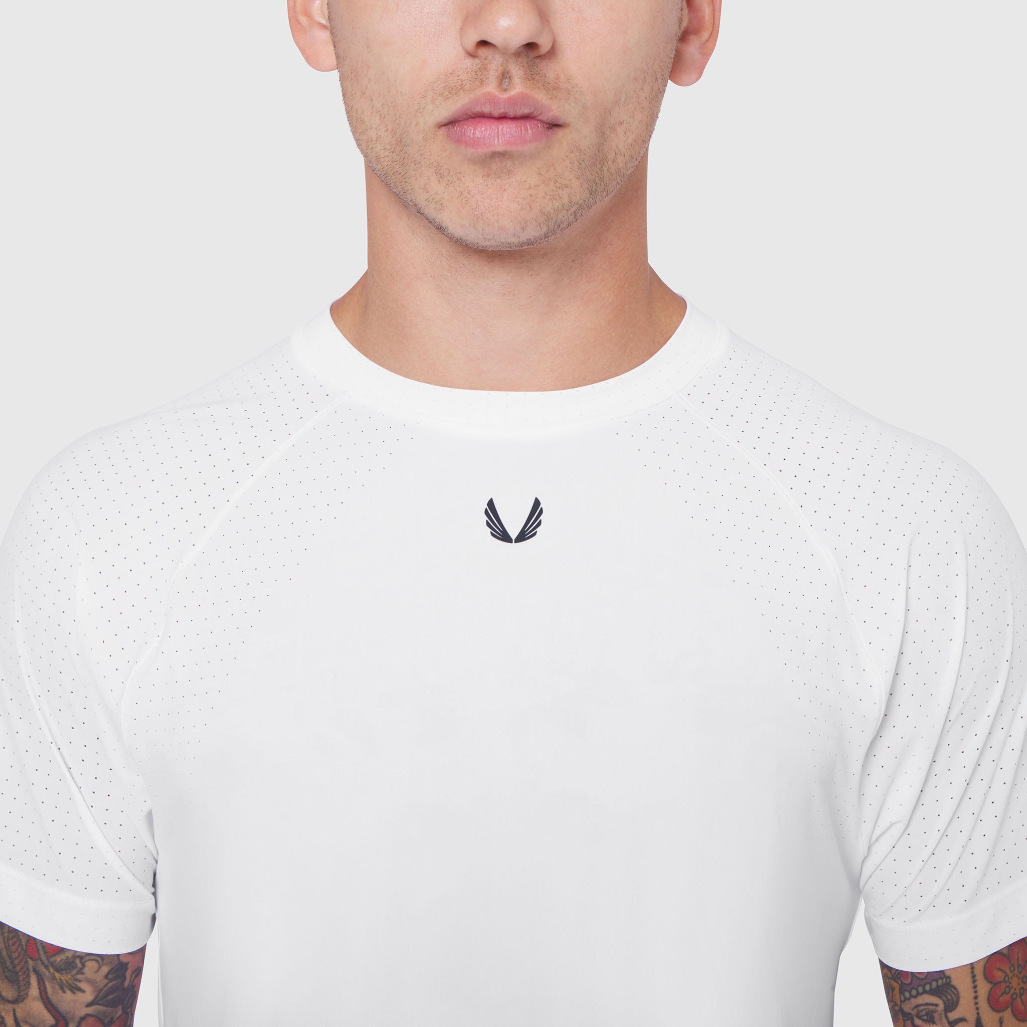 White Laser-Vent Training Tee worn by male model, front view