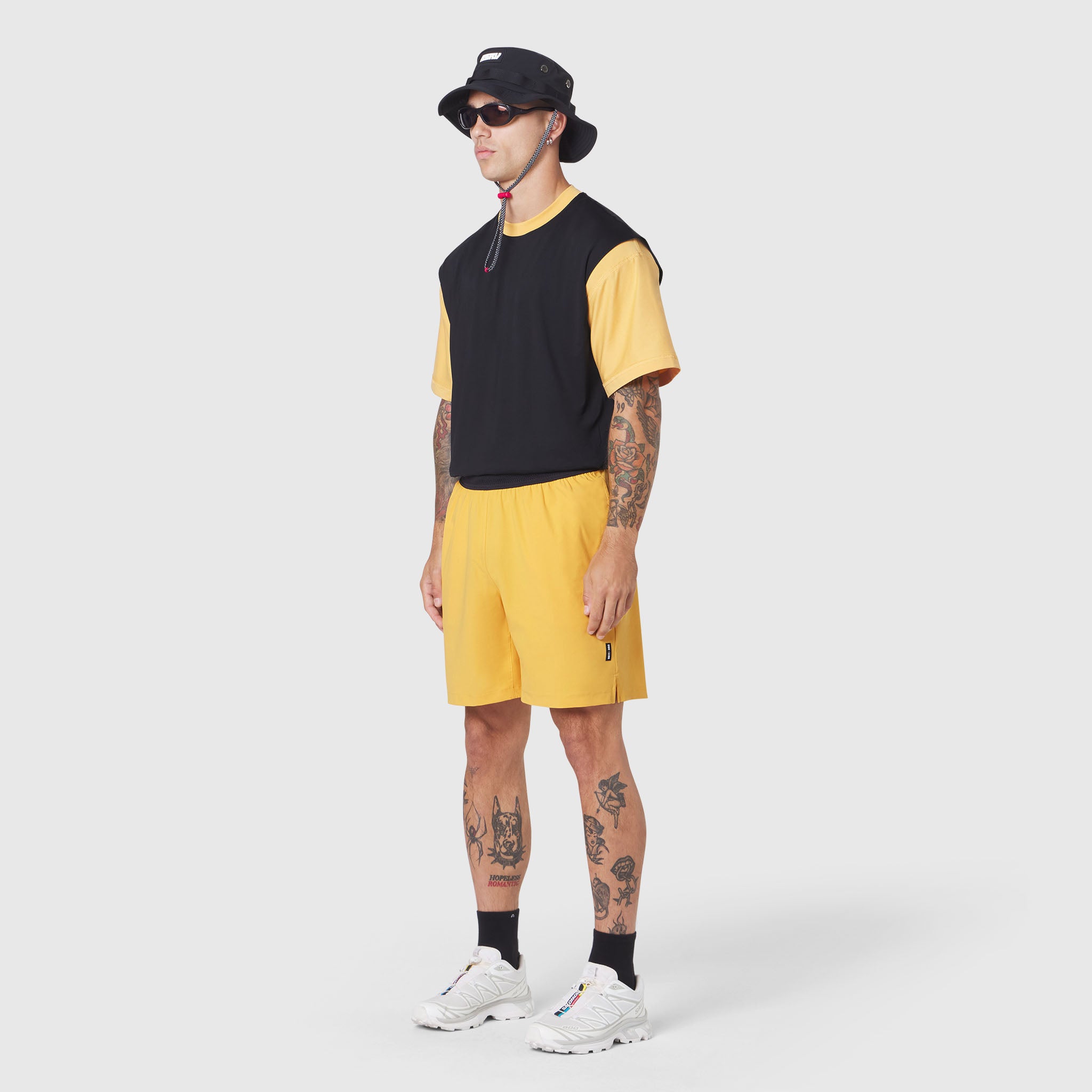 Supima Ice-Skin Reversible Tee in amber and black, worn by model with matching shorts