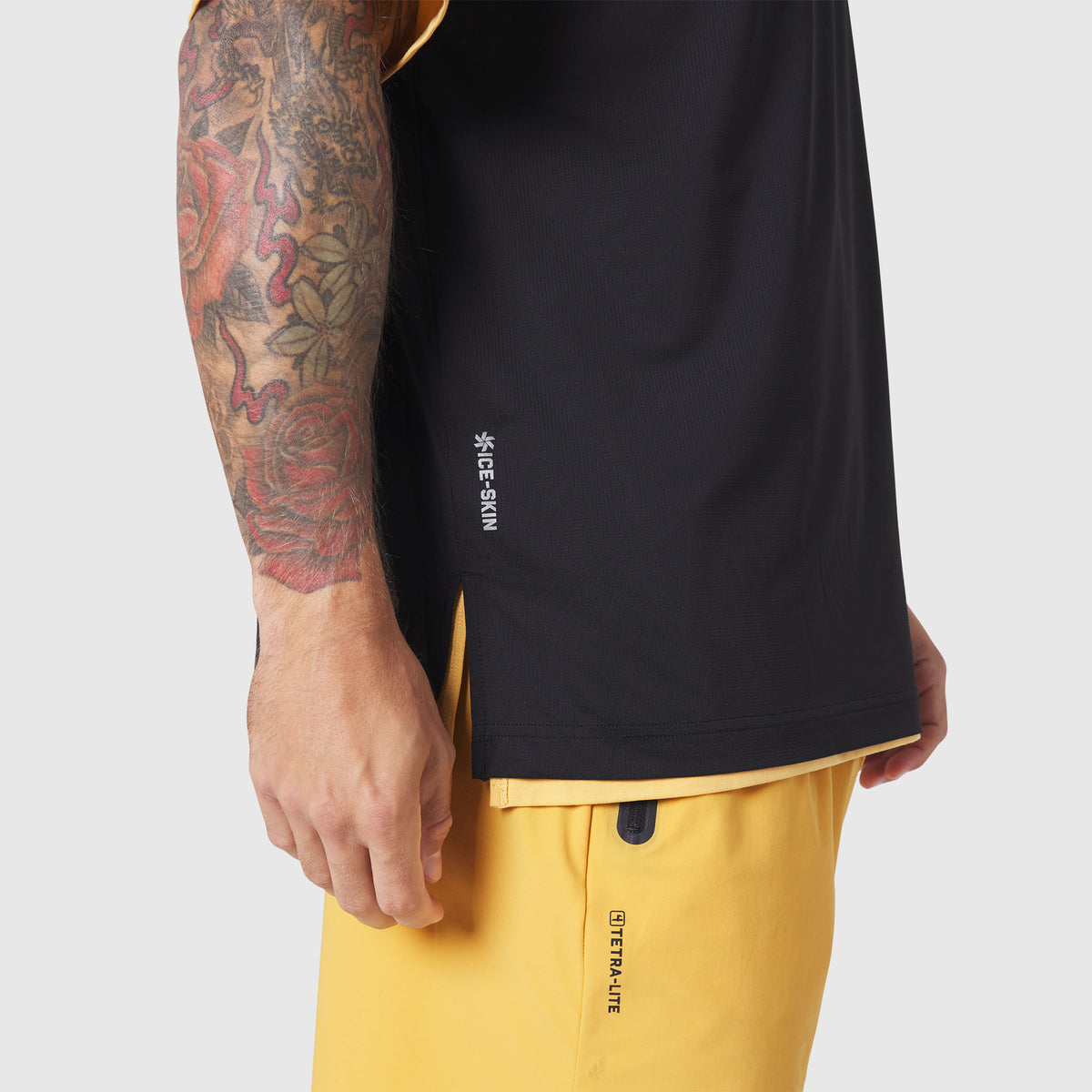 Supima Ice-Skin Reversible Tee in amber and black worn by model showing side view